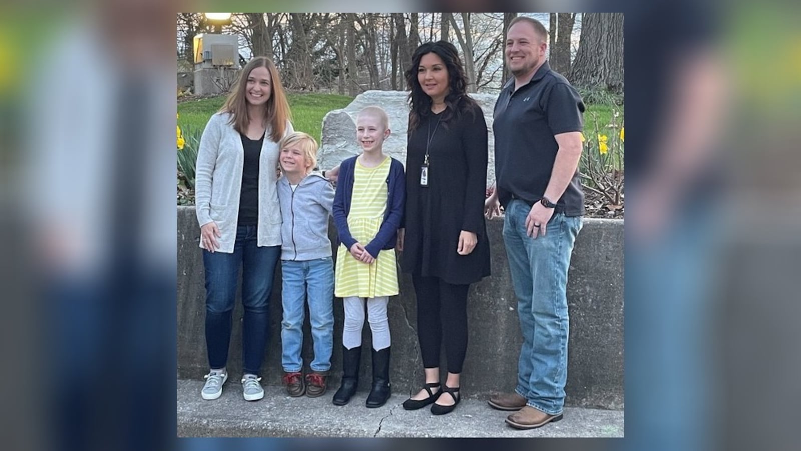 Chloe Adkins (center) became the youngest recipient ever of the Kettering mayor’s volunteer award after continuing to freely offer her services while battling cancer.  Surrounding her, from left to right, are Kettering City Schools gifted intervention specialist, Karen Kronour, Chloe's brother Jake, and their parents, Kelly and Jeff Adkins. CONTRIBUTED