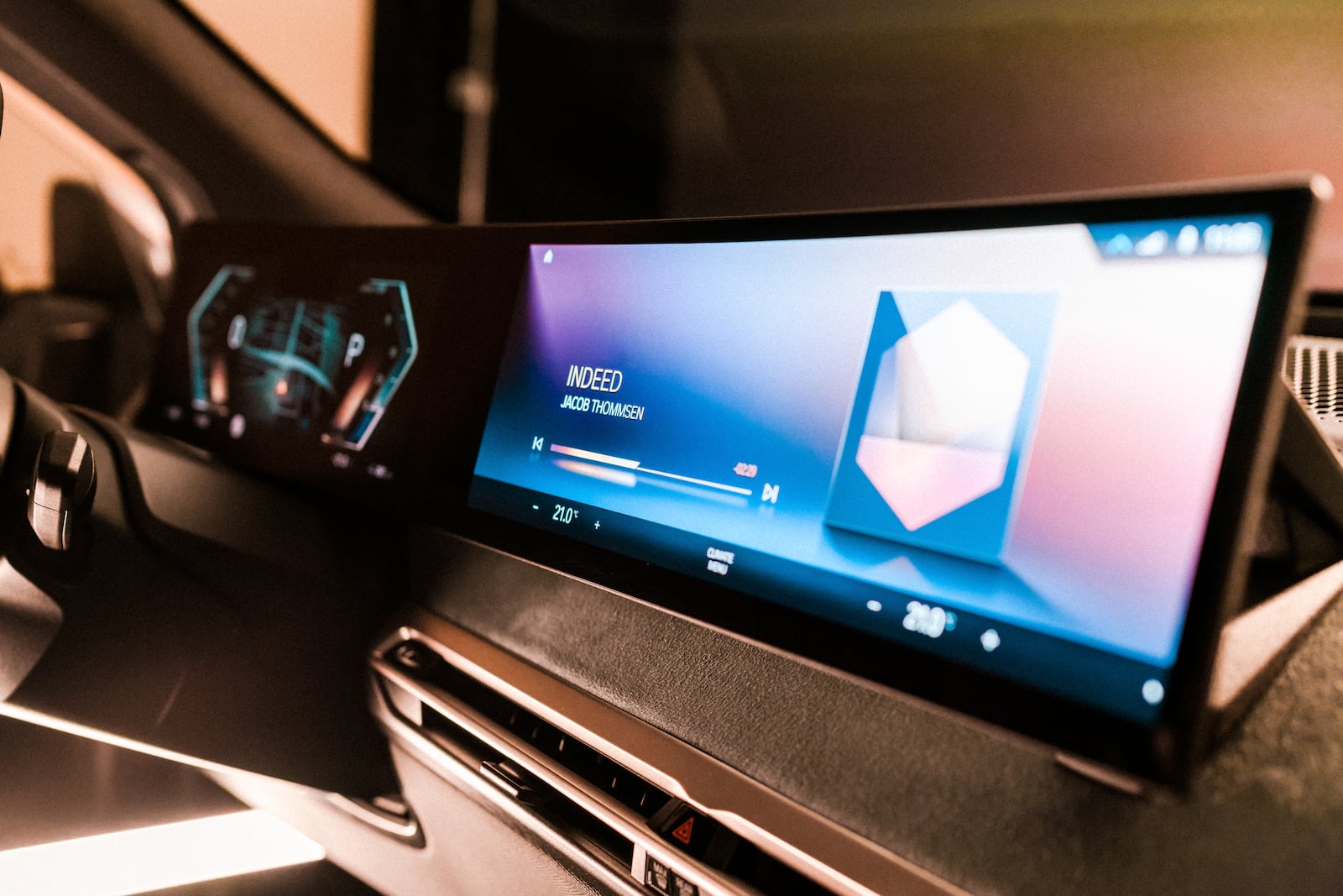 This photo provided by BMW shows the next-generation iDrive operating system and infotainment screen that will debut on the upcoming BMW iX electric vehicle. (BMW of North America via AP)