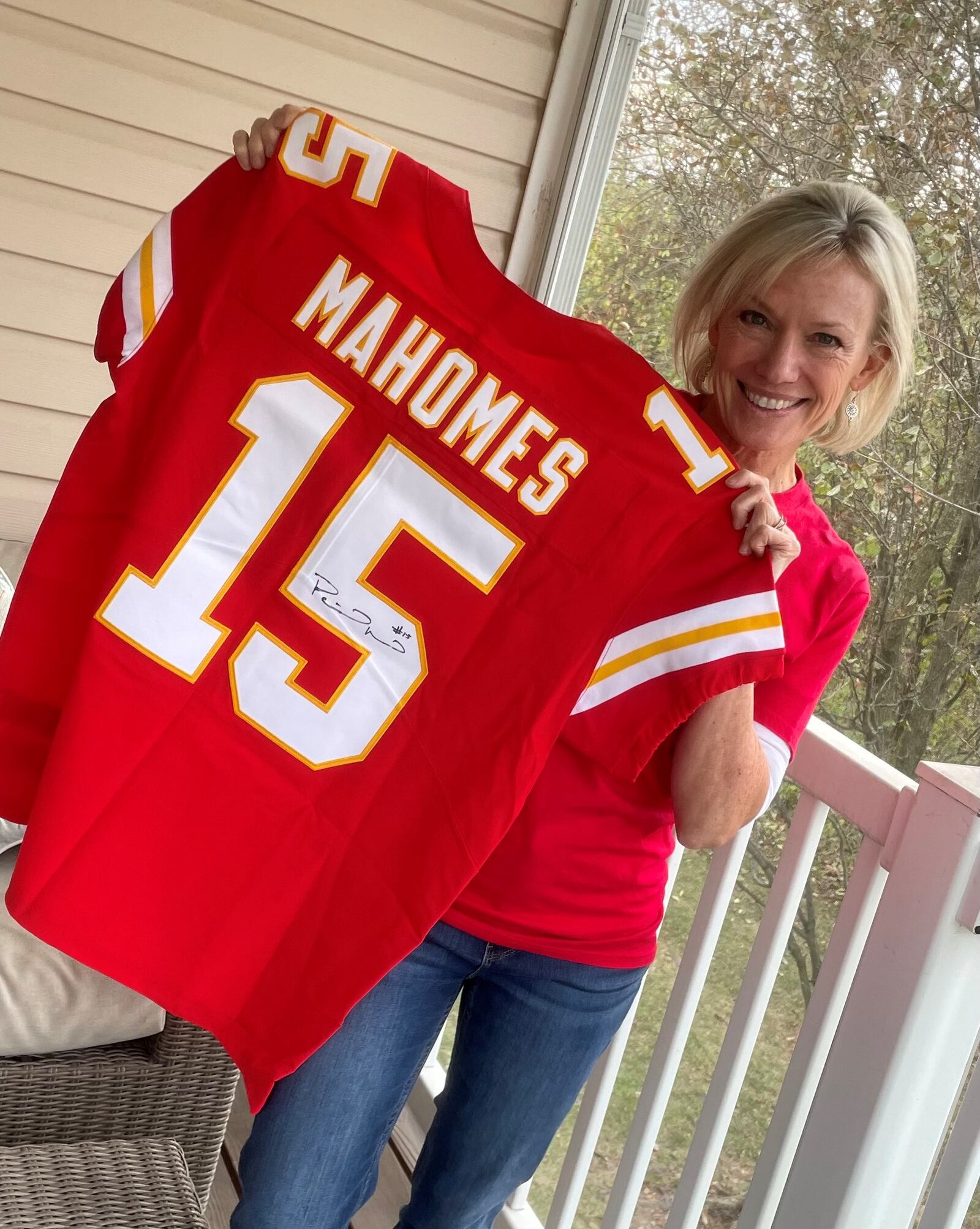 Sherrie Parker, of Mason, with an NFL jersey signed by Patrick Mahomes. CONTRIBUTED