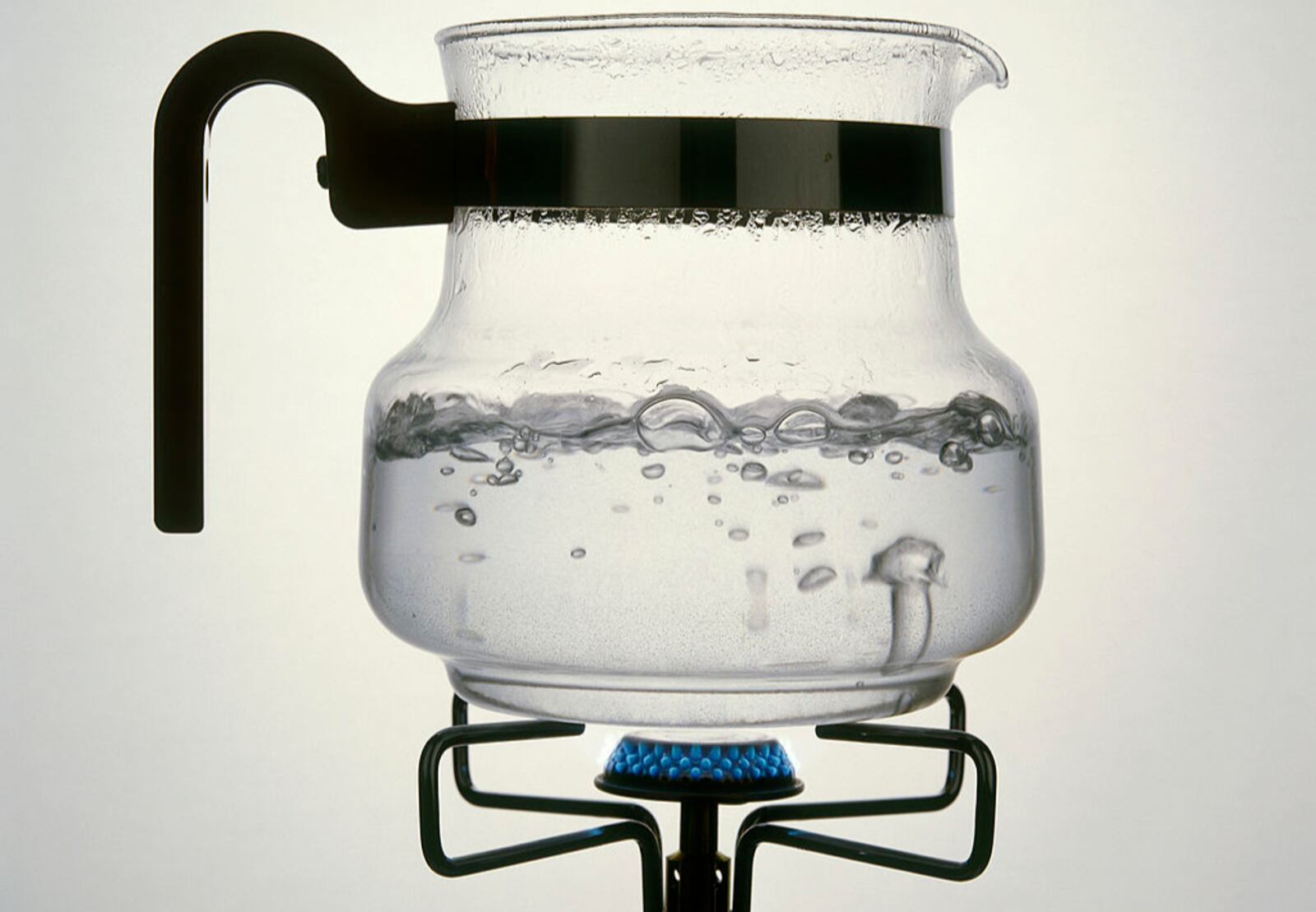 Water, Evaporation, Steam rising from water boiling in a glass jar on a gas ring. (Photo by: Eye Ubiquitous/UIG via Getty Images)