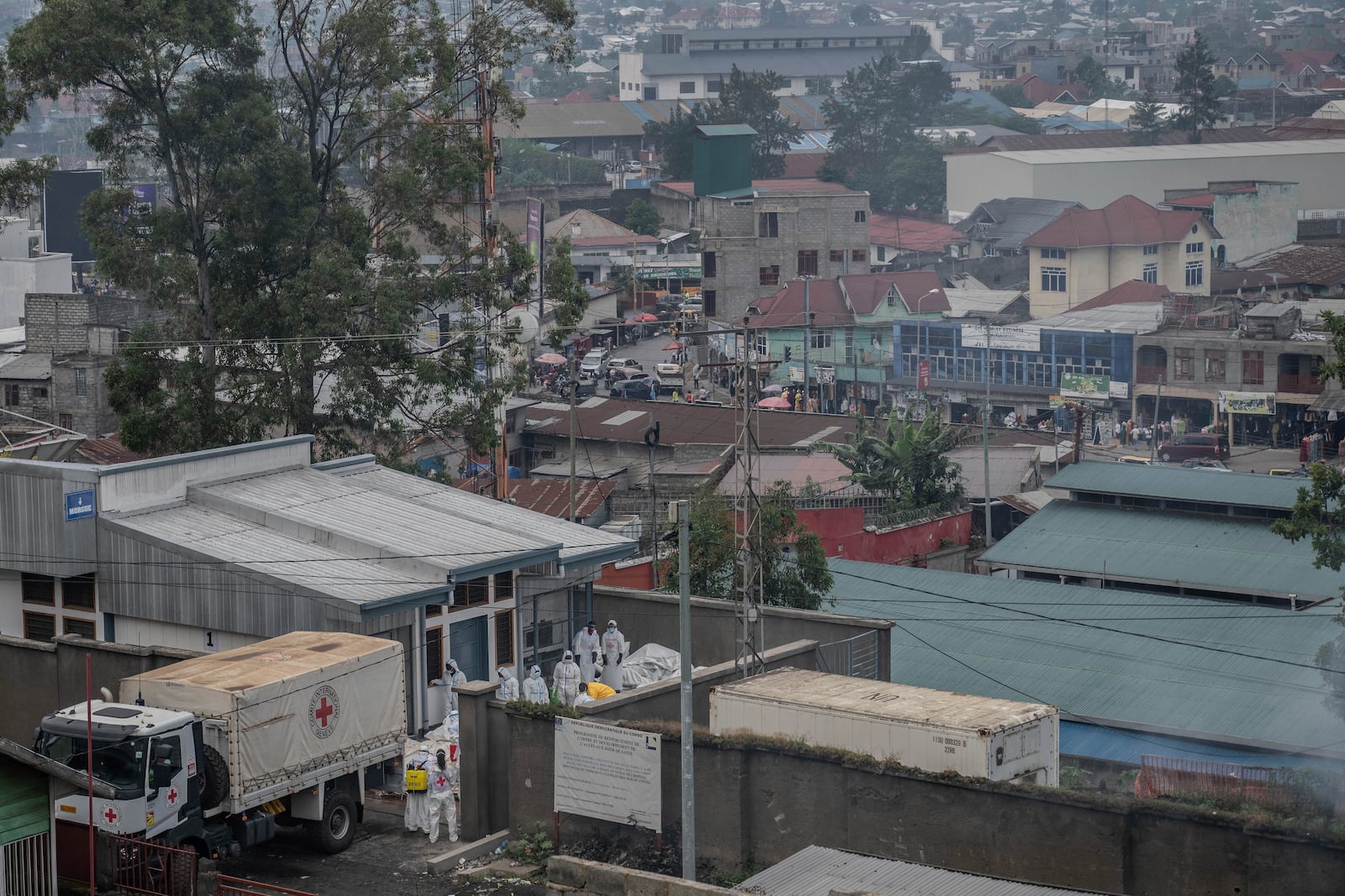 Red Cross personnel load bodies of victims of the fighting between Congolese government forces and M23 rebels in a truck in Goma, Monday, Feb. 3, 2025, as the U.N. health agency said 900 died in the fight. (AP Photo/Moses Sawasawa)