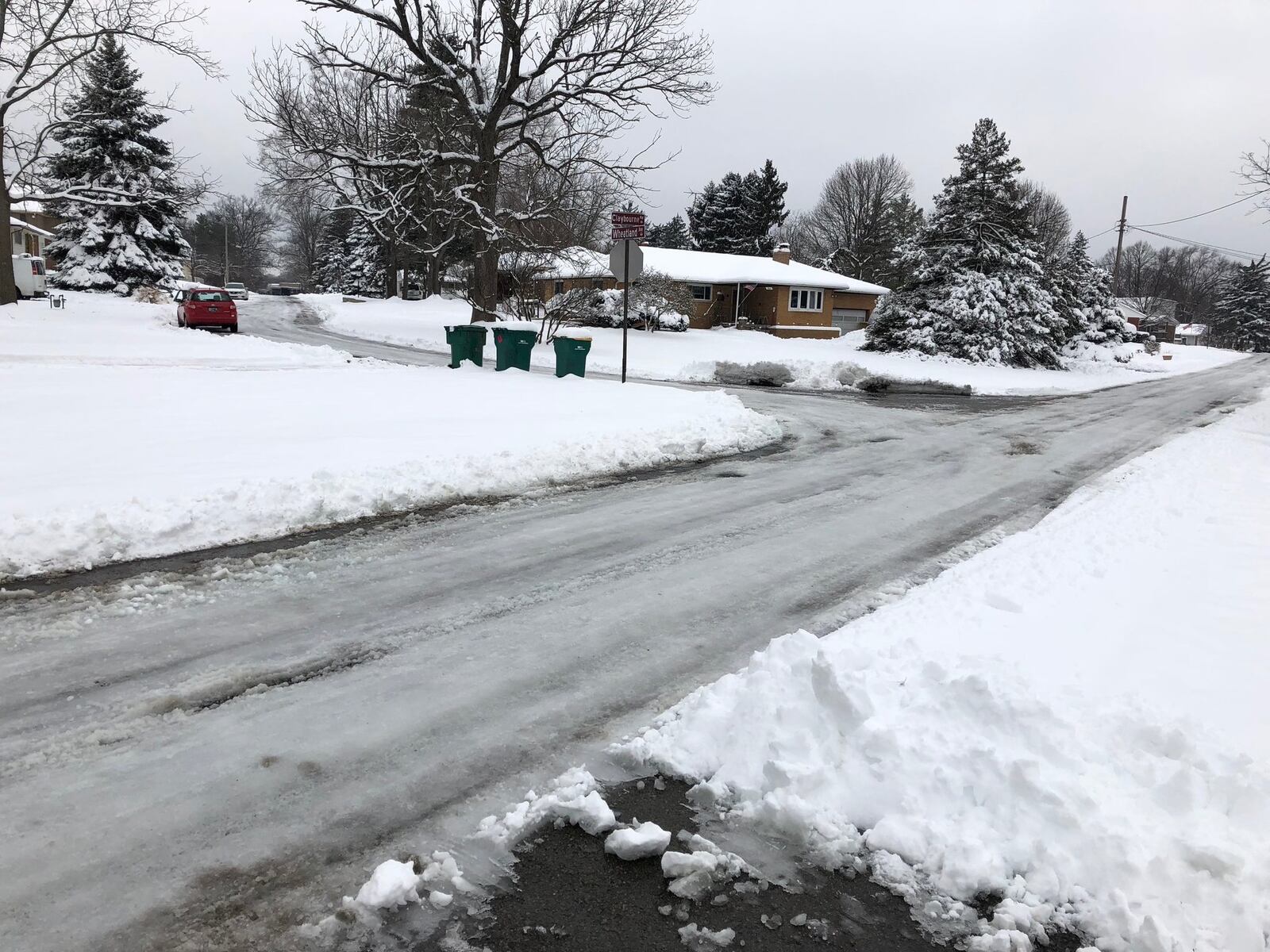 Compacted ice covers pavement at the corner of Claybourne Road and Wheatland Avenue in Kettering, on Monday, Jan. 14, 2019.