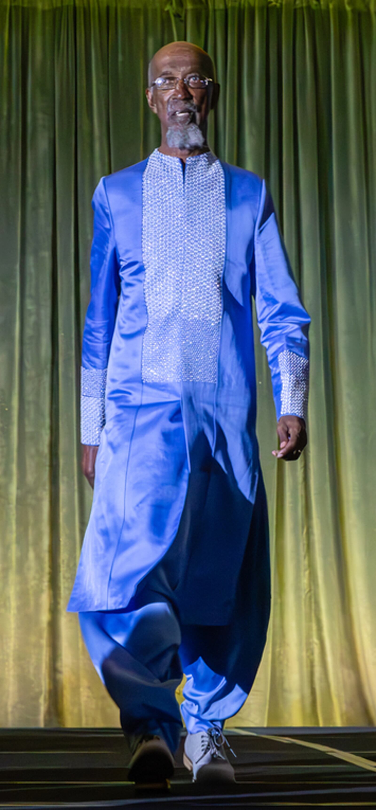 Bing Davis walks down the runway during the fashion show. Contributed by Beth Larsen Photography