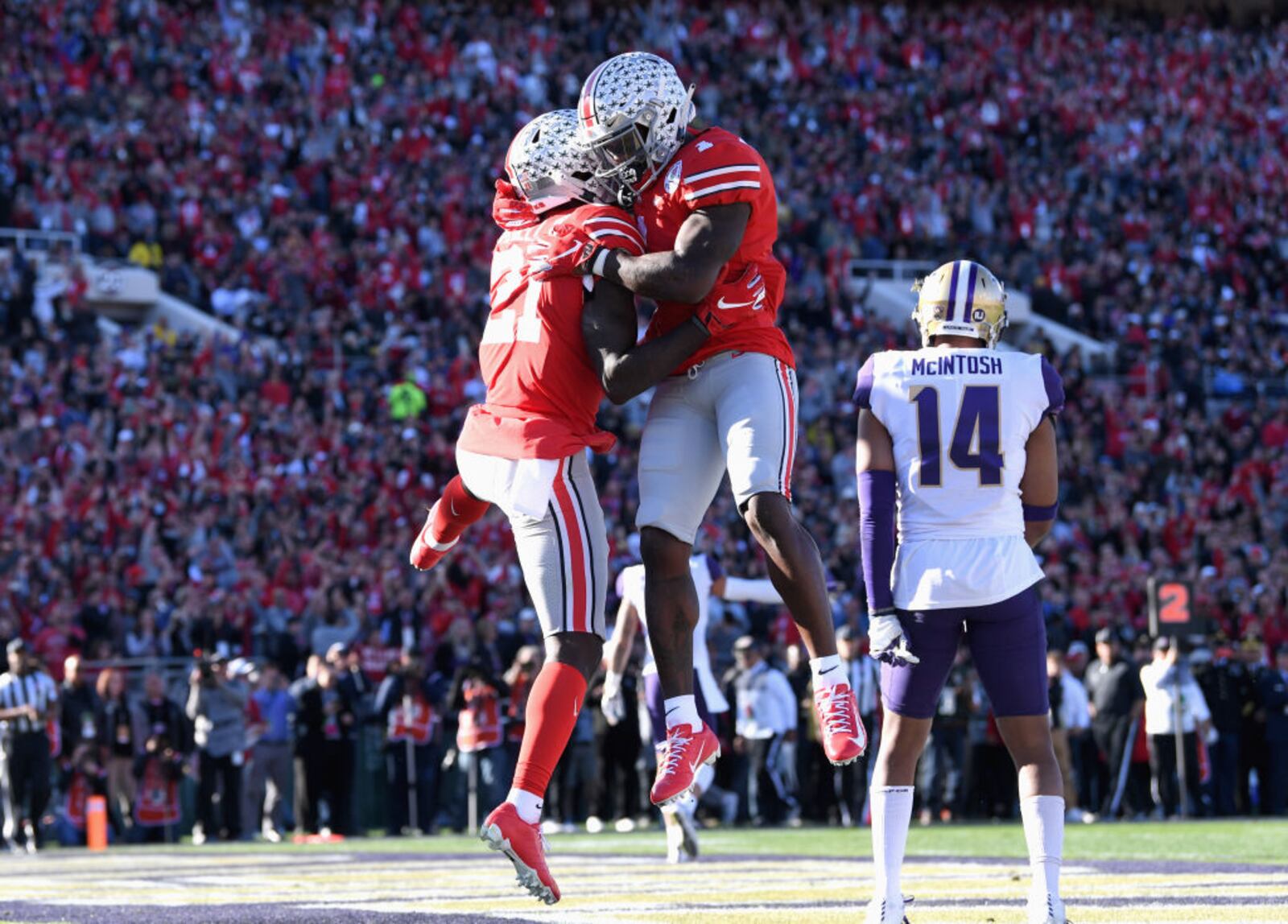 PASADENA, CA - JANUARY 01:  Parris Campbell #21 of the Ohio State Buckeyes and Dwayne Haskins #7 of the Ohio State Buckeyes celebrate a touchdown during the first half in the Rose Bowl Game presented by Northwestern Mutual at the Rose Bowl on January 1, 2019 in Pasadena, California.  (Photo by Harry How/Getty Images)