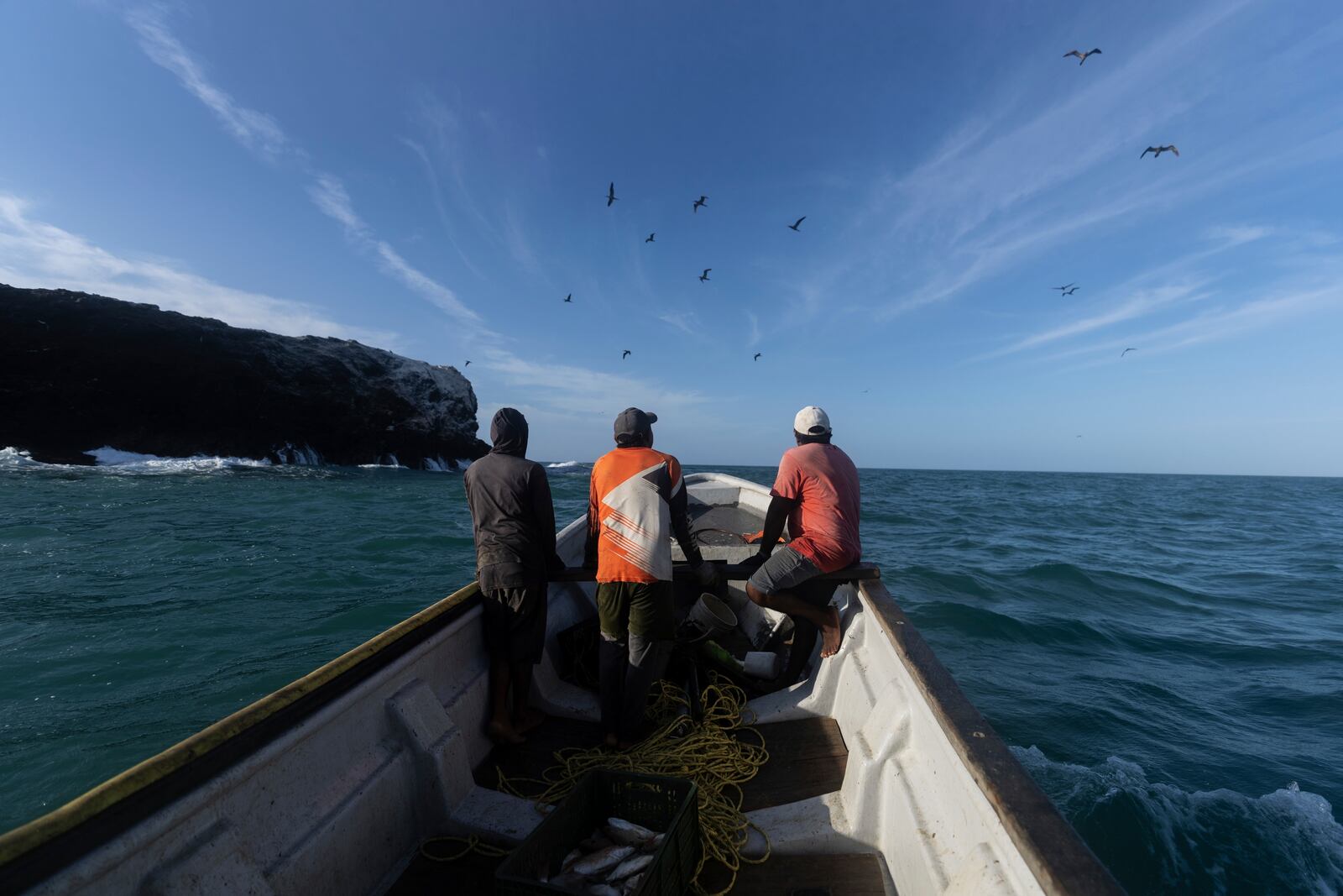 Fishers look for a spot to collect their catch in Cabo de la Vela, Colombia, Friday, Feb. 7, 2025. (AP Photo/Ivan Valencia)