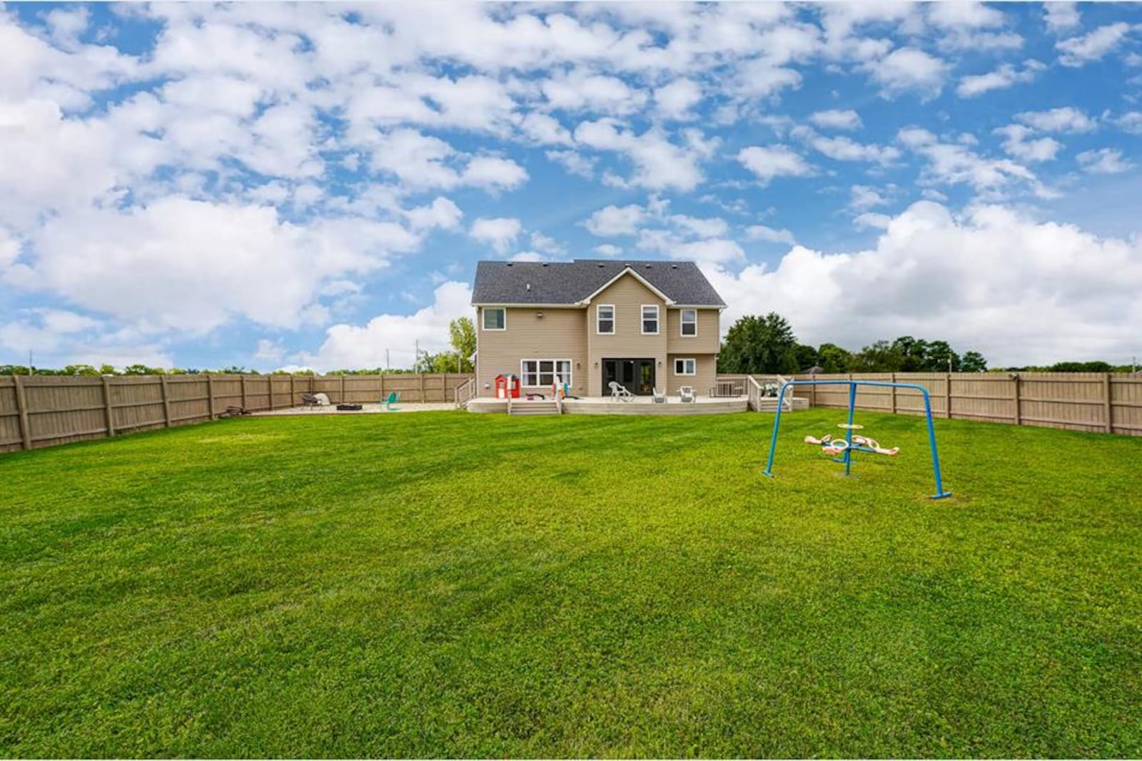 The rear of the property is fenced with a combination of wood privacy and chain link; and there is a 30' x 50' wood deck with three steps leading to yard and hardscaped firepit area. CONTRIBUTED