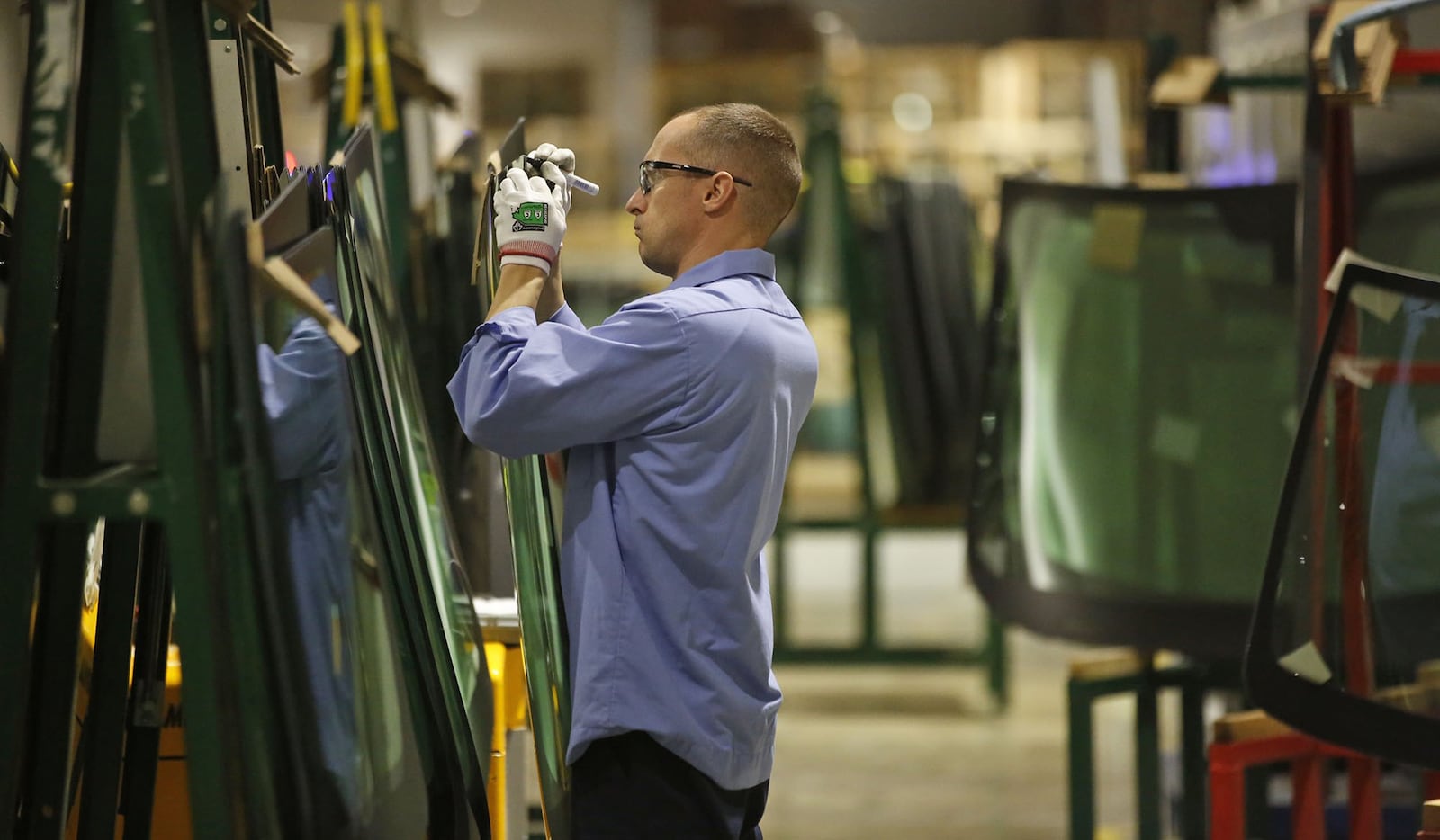 Fuyao Glass America has progressed at a pace that is years ahead of its original schedule and now employs more than 2,000 people. Employees are meticulous about the quality of the glass.  TY GREENLEES / STAFF