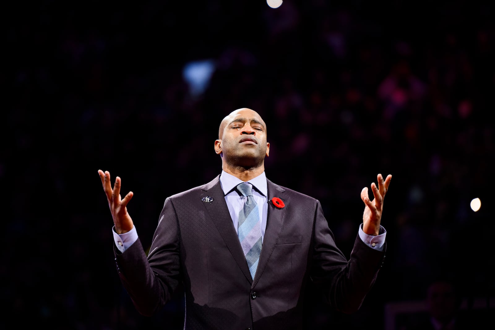 Former Toronto Raptors player Vince Carter reacts during his number retirement ceremony at halftime of an NBA basketball game between the Toronto Raptors and the Sacramento Kings in Toronto on Saturday, Nov. 2, 2024. (Christopher Katsarov/The Canadian Press via AP)