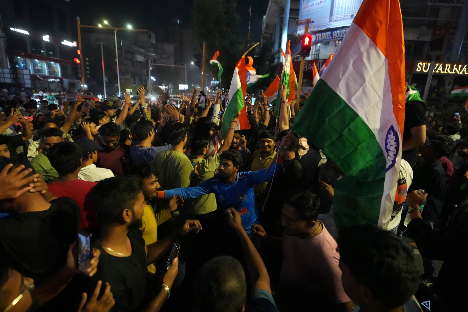 Indian cricket fans celebrate after the Indian team won the ICC Champions Trophy in Dubai, in Ahmedabad, India, Sunday, March 9, 2025. (AP Photo/Ajit Solanki)