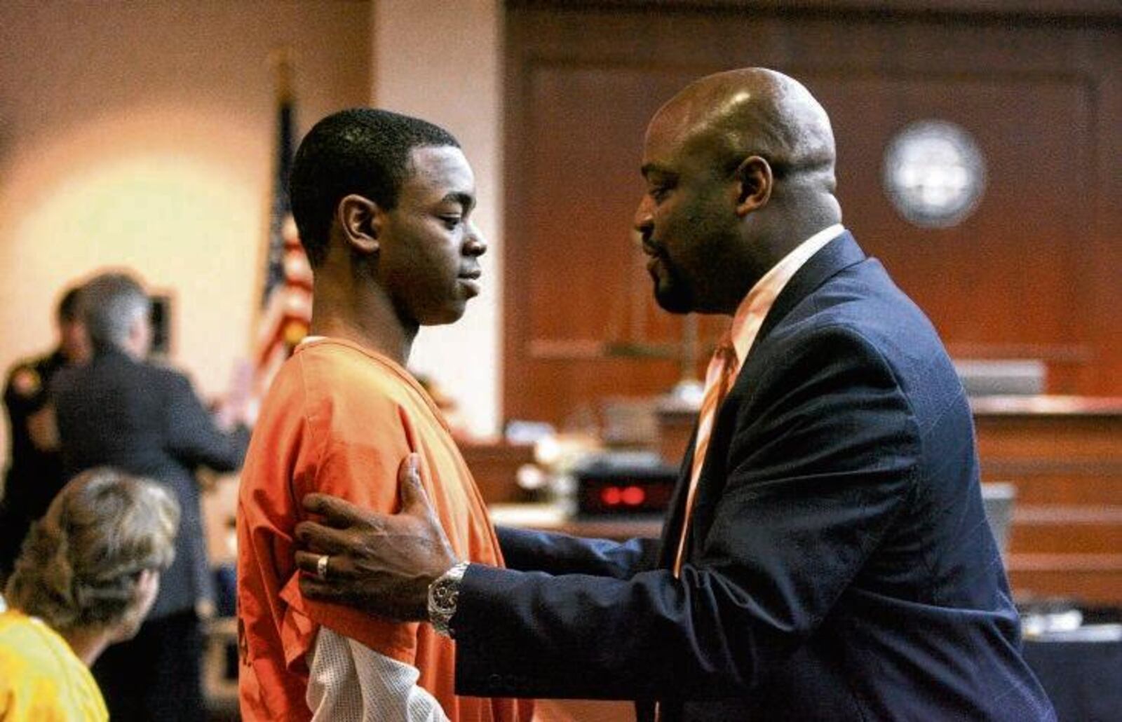 Marqui Conley, 18, of Middletown, talks with his attorney, David Washington, on Thursday before he was sentenced to five years in prison by Butler County Common Pleas Judge Andrew Nastoff for causing the death of a man he intentionally ran down with a car last summer.