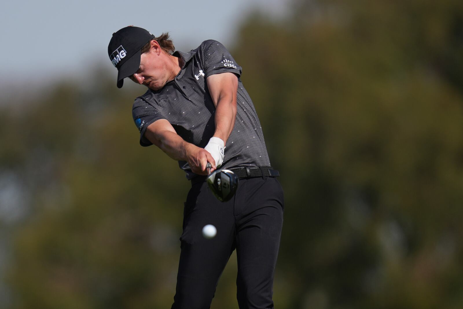 Maverick McNealy hits off the second tee of the South Course at Torrey Pines during the final round of the Genesis Invitational golf tournament Sunday, Feb. 16, 2025, in San Diego. (AP Photo/Gregory Bull)