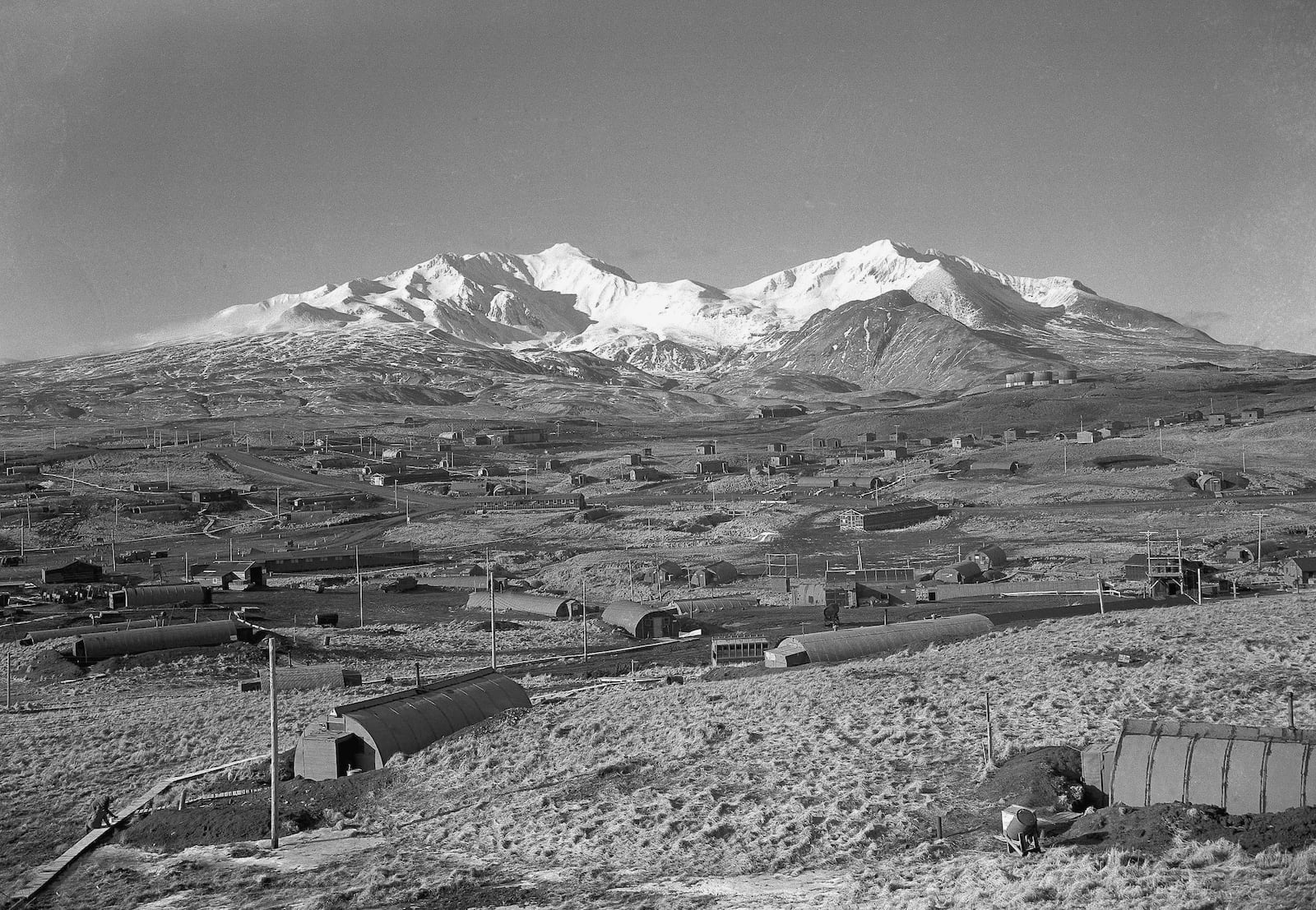 FILE - Army's task force Williwaw camp on Alaska's Adak Island, on Feb. 3, 1947, with Mount Moffett in background. (AP Photo/Joseph D. Jamieson, File)