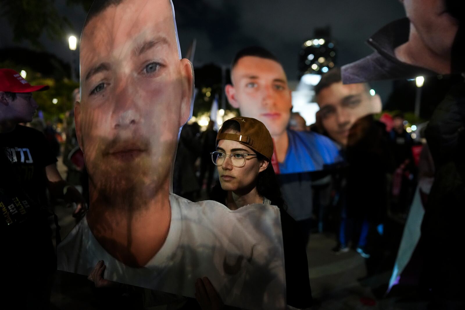 People hold photos of hostages held by Hamas in Gaza during a rally calling for their return, in Tel Aviv, Israel, Tuesday, Feb. 4, 2025, ahead of the planned meeting between U.S. President Donald Trump and Israeli Prime Minister Benjamin Netanyahu. (Photo/Ohad Zwigenberg)