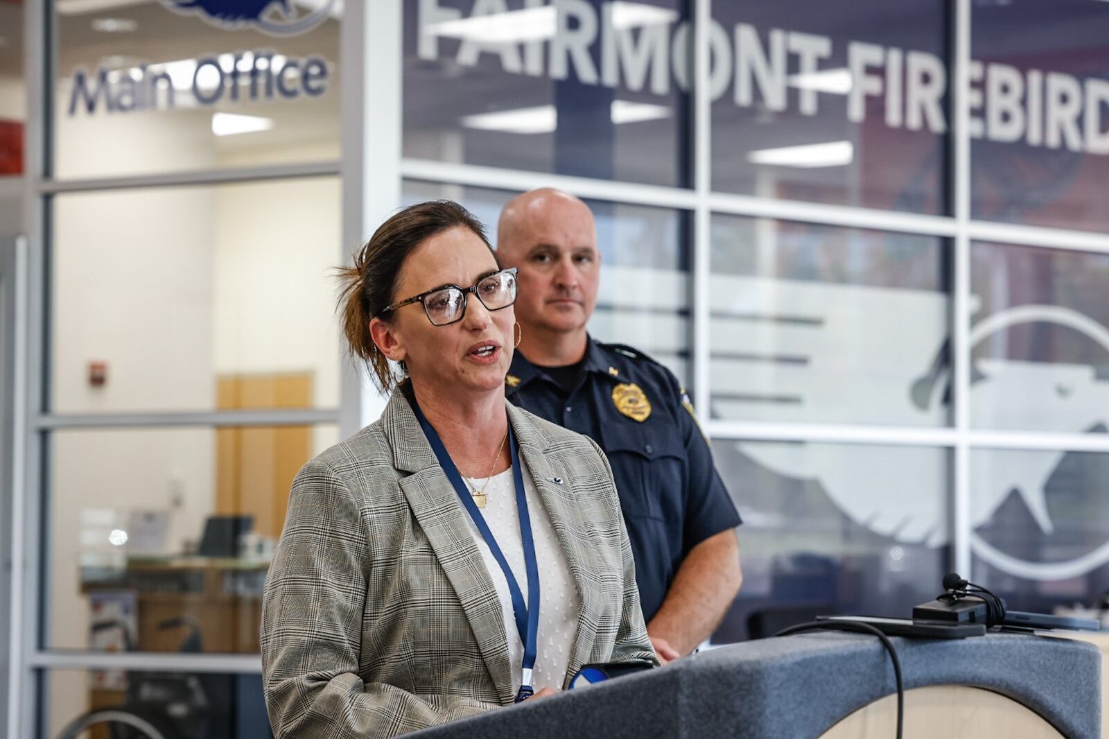 Mindy McCarty-Stewart, superintendent for Kettering City Schools, held a press conference Tuesday May 9, 2023 at Kettering Fairmont High School, addressing a social media threat of violence that was posted Monday. At right is Kettering police chief Chip Protsman. JIM NOELKER/STAFF