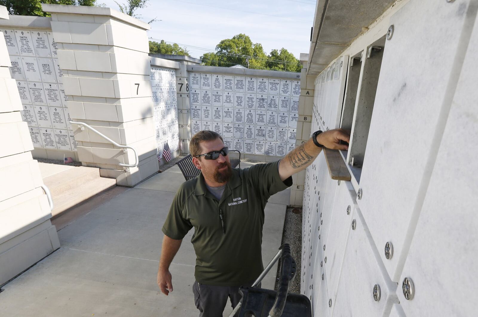 Dayton National Cemetery foreman Rick Colosky with the columbarium on the north side of the cemetery. TY GREENLEES / STAFF