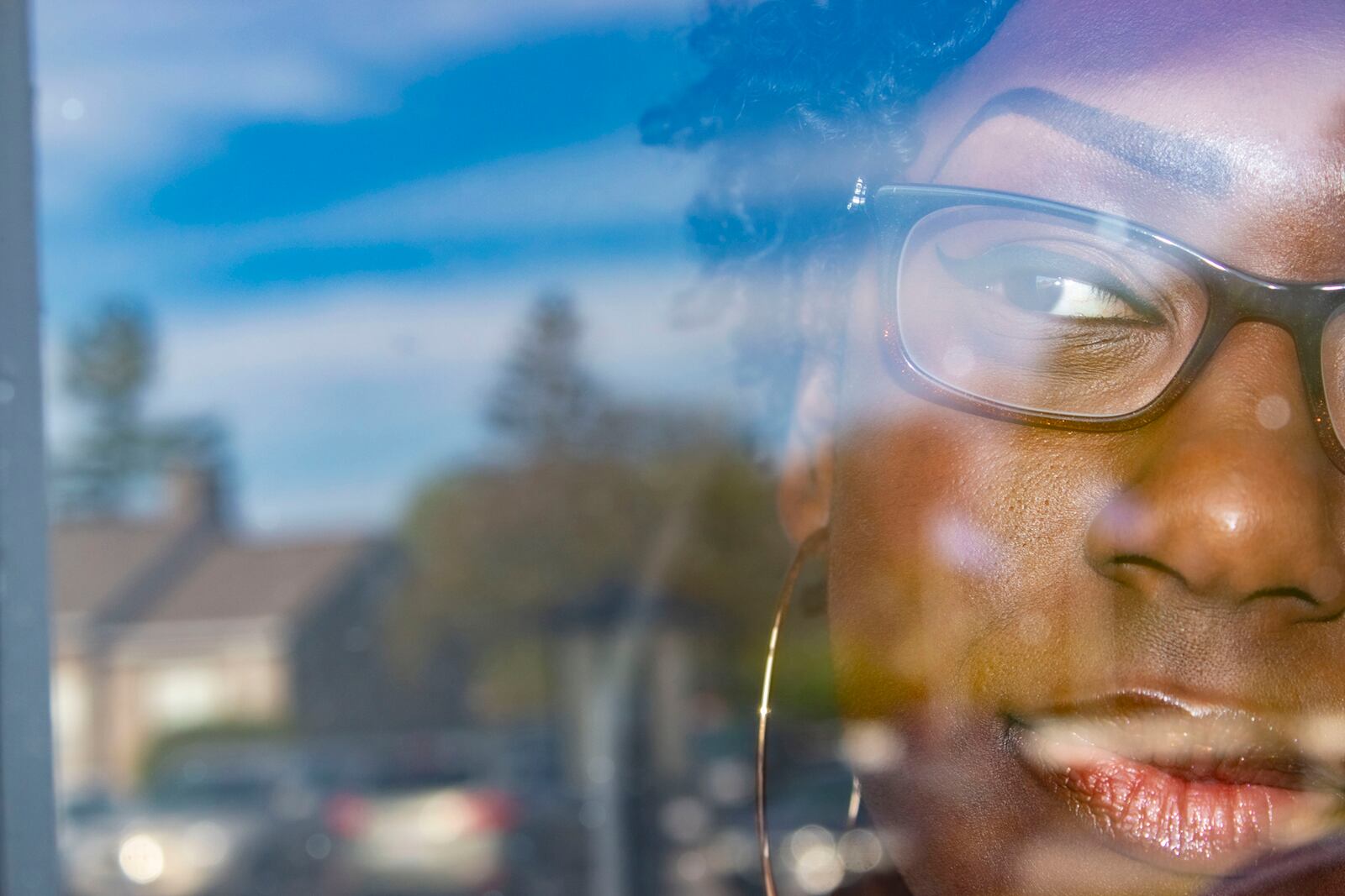 Ishmael McKinney, "Outside," one of the selected images highlighted in The Contemporary and Dayton Daily News collaboration "In the Balance: Reflections of Our Community During COVID." "These photos were taken as a part of my QuaranZine project focusing on the new normal that exists due to the pandemic. 'Outside' captures the model Tiara Whatley gazing out the window of her apartment as the pandemic made going outside a daunting task."