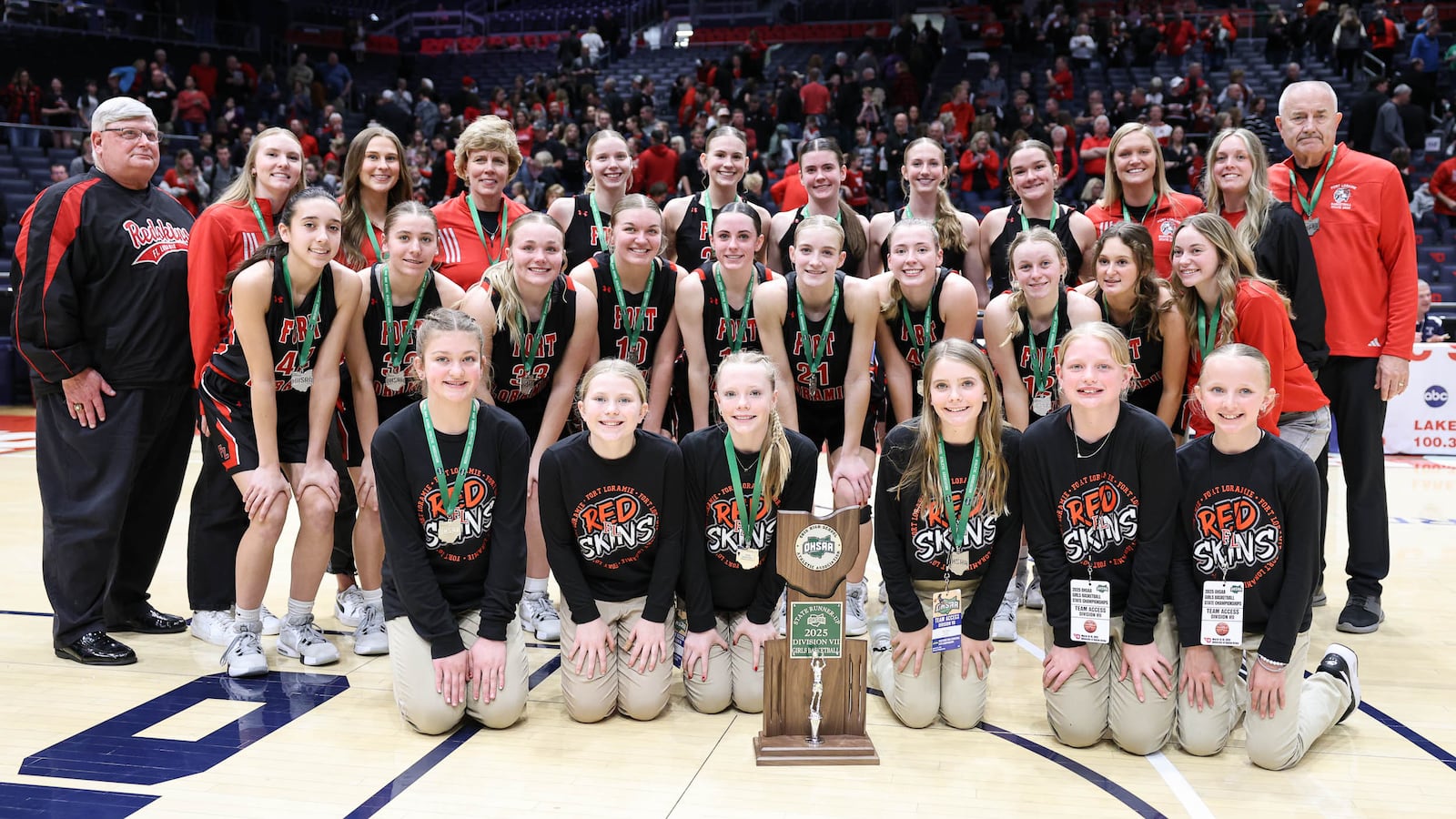 Fort Loramie players and coaches pose for a team photo following a 48-46 loss to Waterford in the Division VII state final on Saturday at University of Dayton Arena. BRYANT BILLING / STAFF