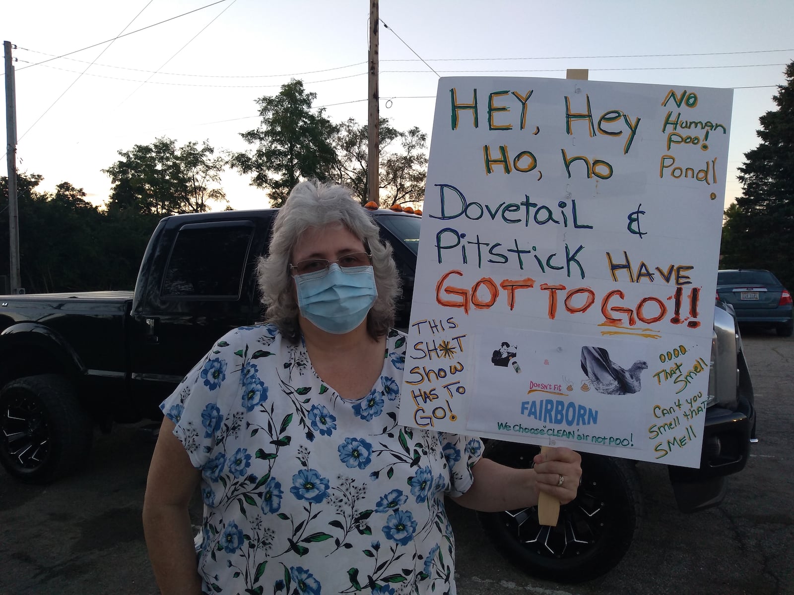 KJ Sims holds a sign at a protest against bio-energy company Renergy last week in Bath Twp. Bath Twp. and Fairborn residents have been fighting against the company for years. CONTRIBUTED