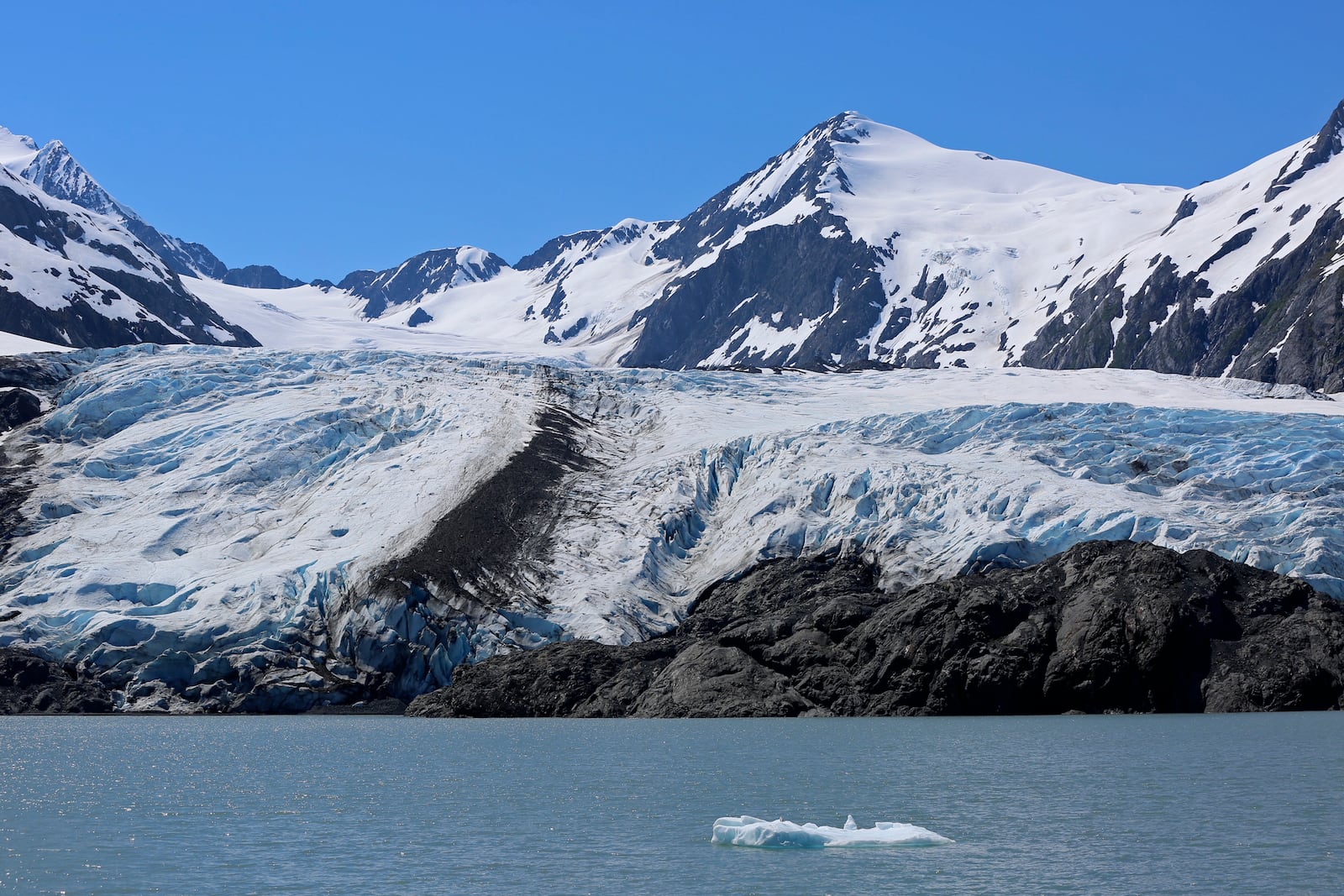 FILE - A chunk of ice floats past the Portage Glacier near Girdwood, Alaska, on June 14, 2021. (AP Photo/Mark Thiessen, file)