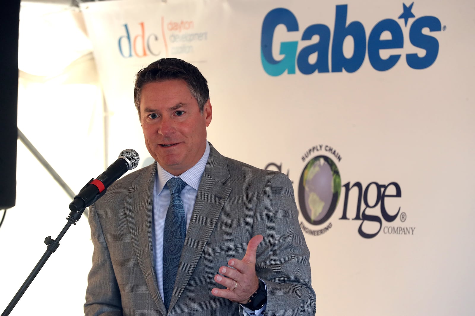 Mike McDorman, president of the Greater Springfield Partnership, speaks during a groundbreaking ceremony for the new Gabe's distribution center in this 2021 file photo. BILL LACKEY/STAFF