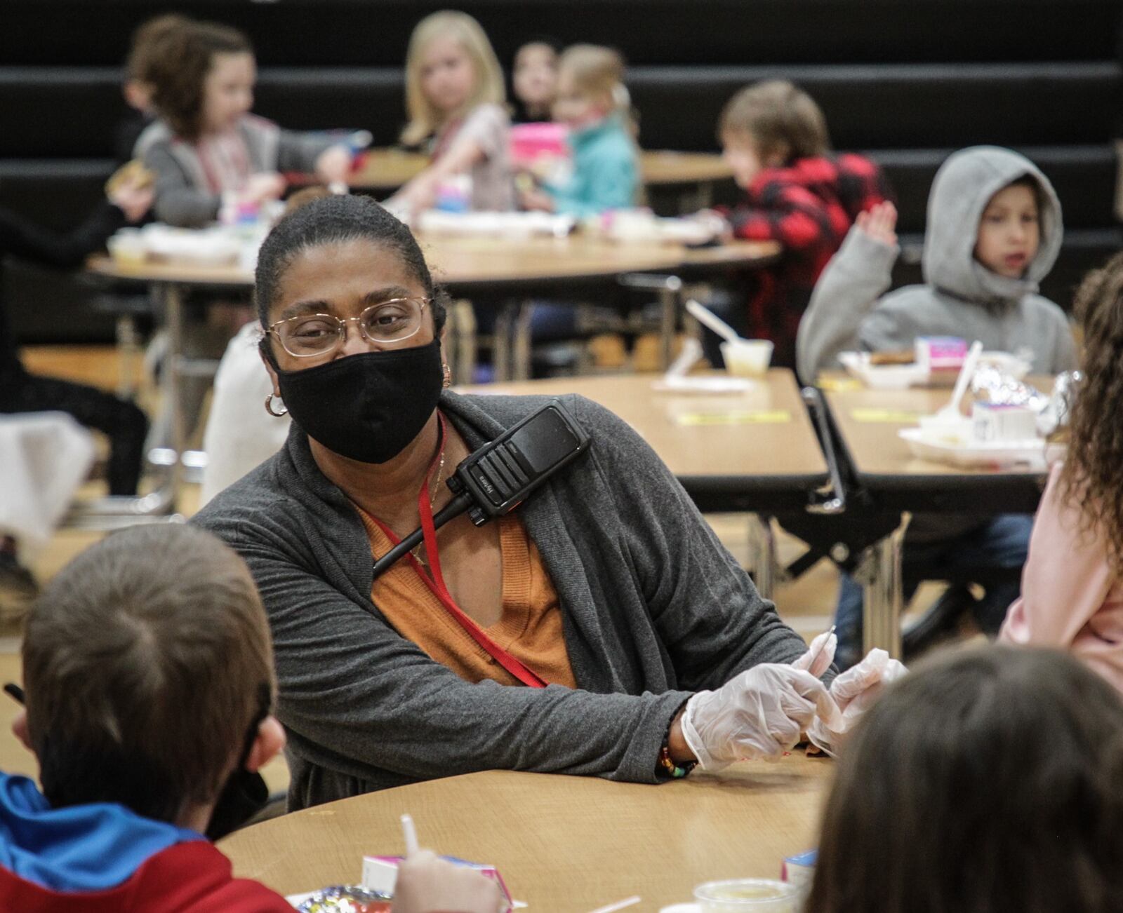 Monticello Elementary Principal, Dwon Bush talks with student during lunch at the school Thursday April 15, 2021. JIM NOELKER / STAFF