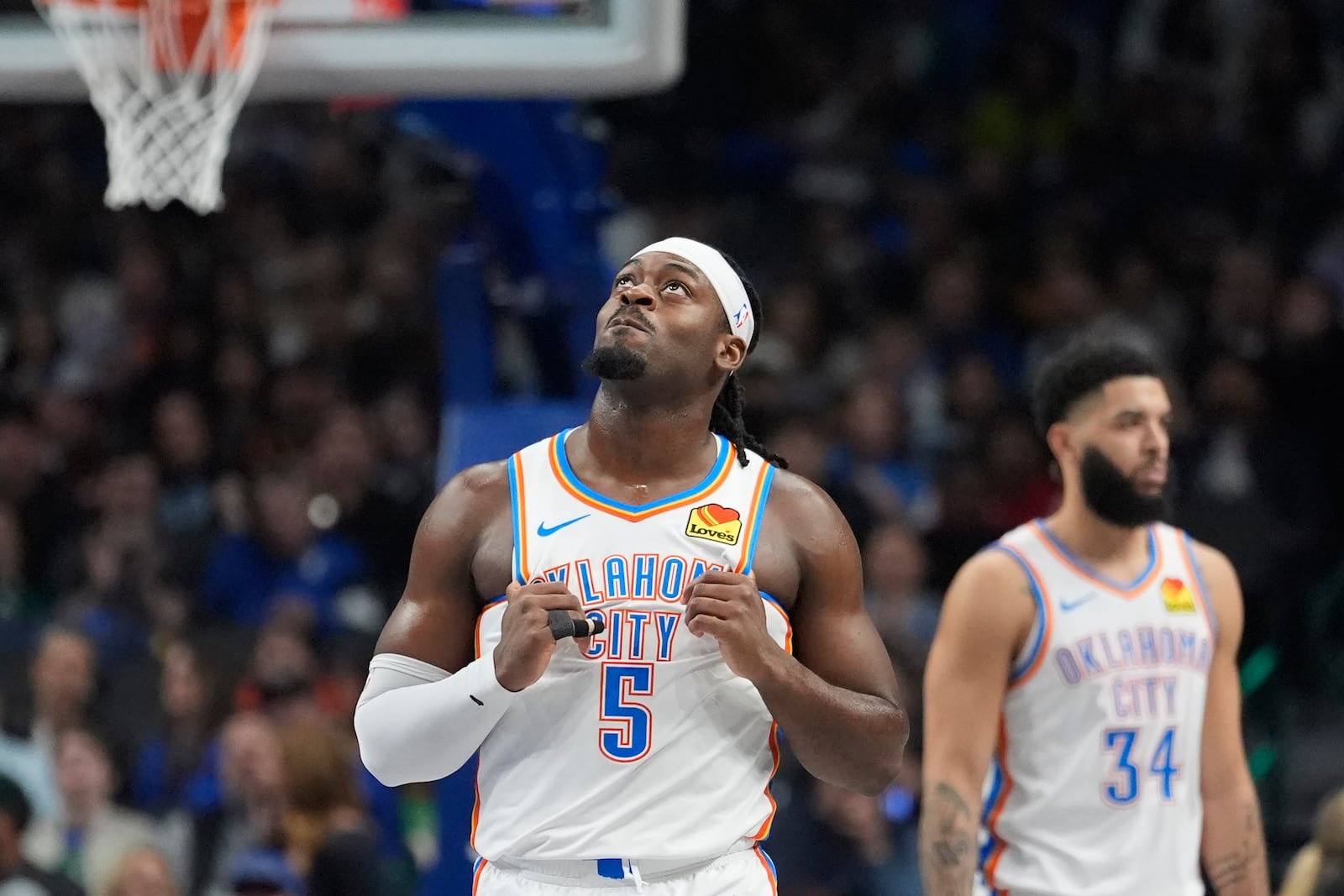 Oklahoma City Thunder guard Luguentz Dort (5) looks up after being called for a foul during the first half of an NBA basketball game against the Dallas Mavericks Friday, Jan. 17, 2025, in Dallas. (AP Photo/LM Otero)