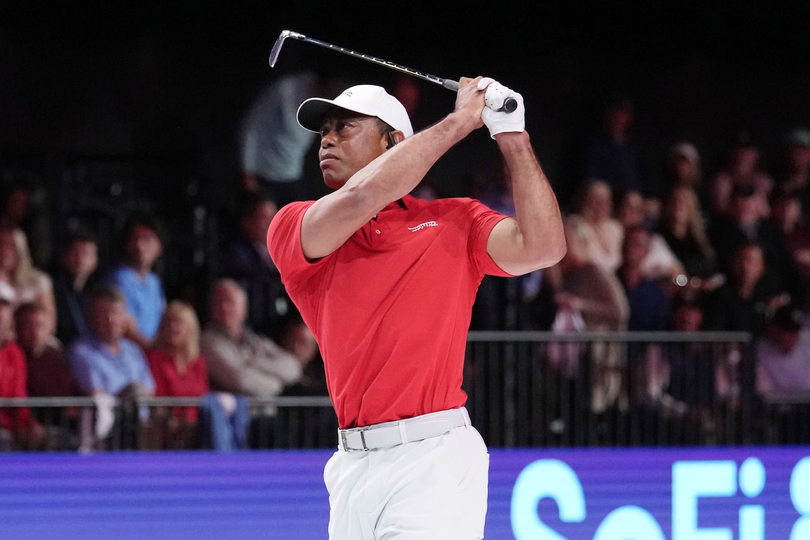 Tiger Woods of the Jupiter Links Golf Club tees off from the 12 hole during a match against the Los Angeles Golf Club, Tuesday, Jan. 14, 2025, in Palm Beach Gardens, Fla. (AP Photo/Marta Lavandier).