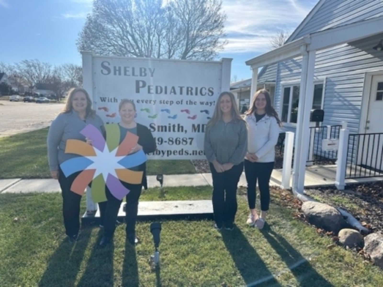 Staff at Shelby Pediatrics hold up Dayton Children's logo after recently being acquired by the Dayton-based children's health system. Shelby Pediatrics, a primary care office located at 1431 N. Main Ave. in Sidney, will become part of the Dayton Children’s health system while still keeping its same name and doctors. CONTRIBUTED