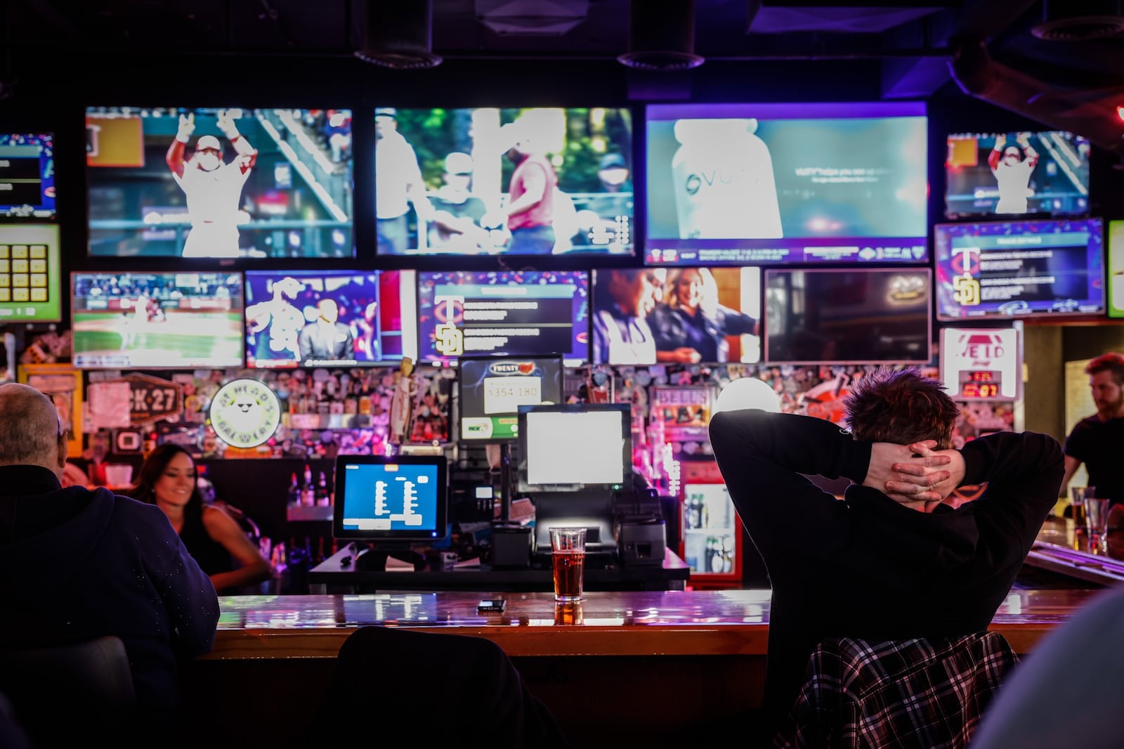 Baseball was on the televisions at Fricker's on Springboro Pike near the Dayton Mall Thursday evening April 7, 0222. Exactly when Ohioans will have the opportunity to make a legal sports bet in the state remains unknown, but an expert says it’s possible it will be just a few months away. JIM NOELKER/STAFF