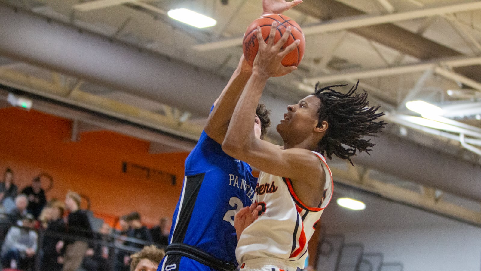 Beavercreek's Isaiah-Michael Williams is fouled by Springboro's Brayden Wilhite during Friday night's game at Beavercreek. Jeff Gilbert/CONTRIBUTED