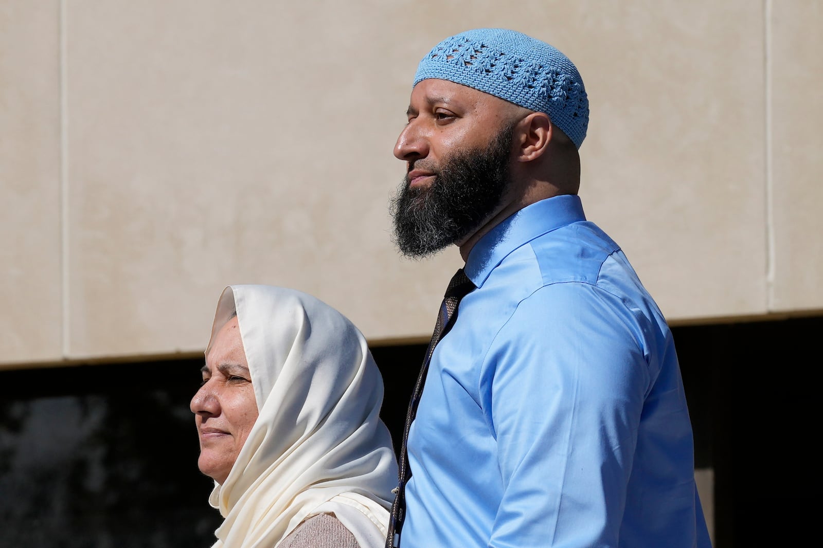 FILE - Adnan Syed, right, and his mother Shamim Rahman, follow attorney Erica Sutter, not in the photo, to talk with reporters outside Maryland's Supreme Court in Annapolis, Md., Oct. 5, 2023, following arguments in an appeal by Syed, whose conviction for killing his ex-girlfriend more than 20 years ago was chronicled in the hit podcast "Serial." (AP Photo/Susan Walsh, File)