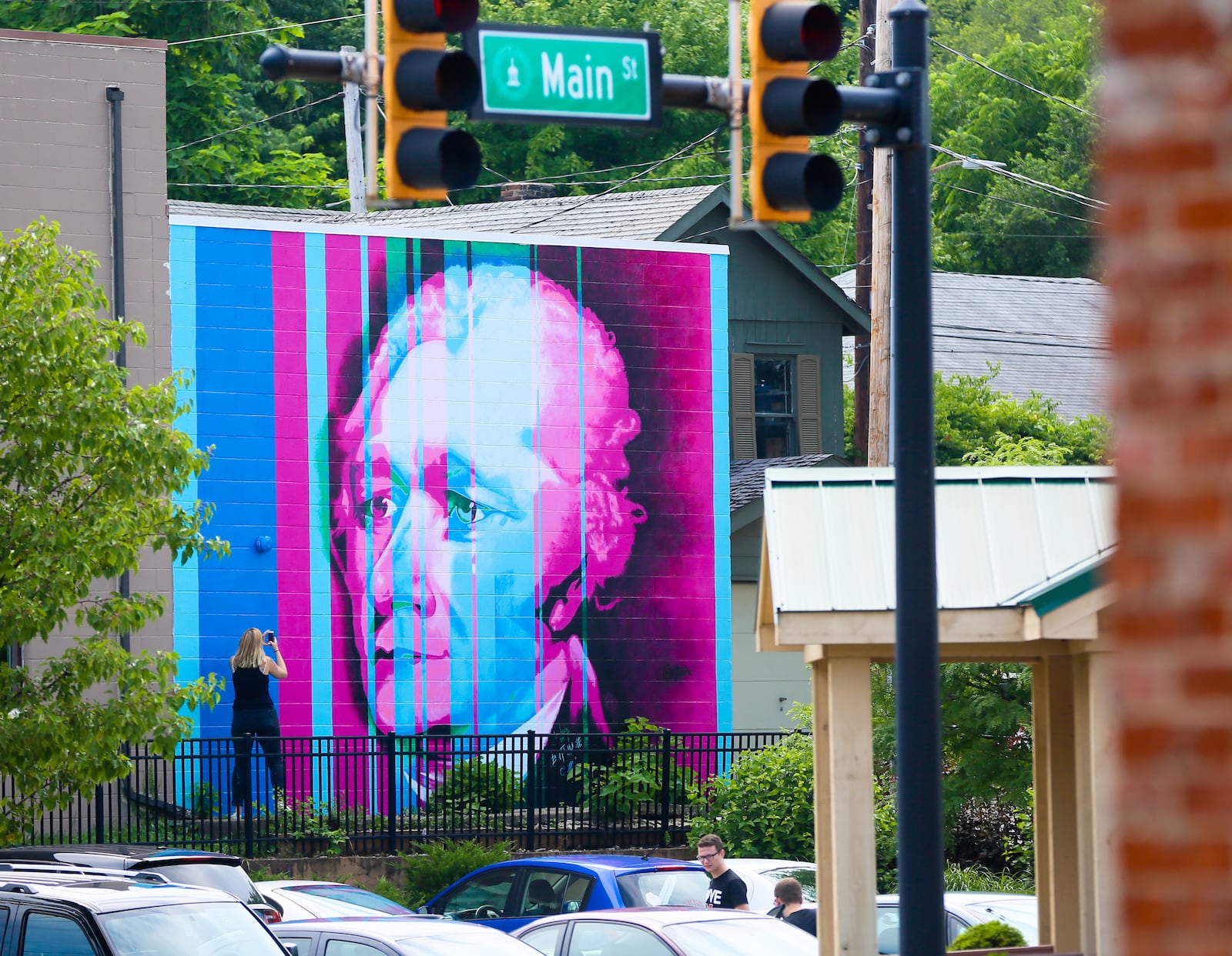 The scaffolding is down on the recently completed Alexander Hamilton mural painted on the building at 15 S. D St. in Armstead Park in Hamilton. The mural is a stylized image of Alexander Hamilton, based on John Trumbull's iconic 1806 portrait. The mural was designed by Miami University Hamilton art instructor Nicole Trimble. GREG LYNCH / STAFF