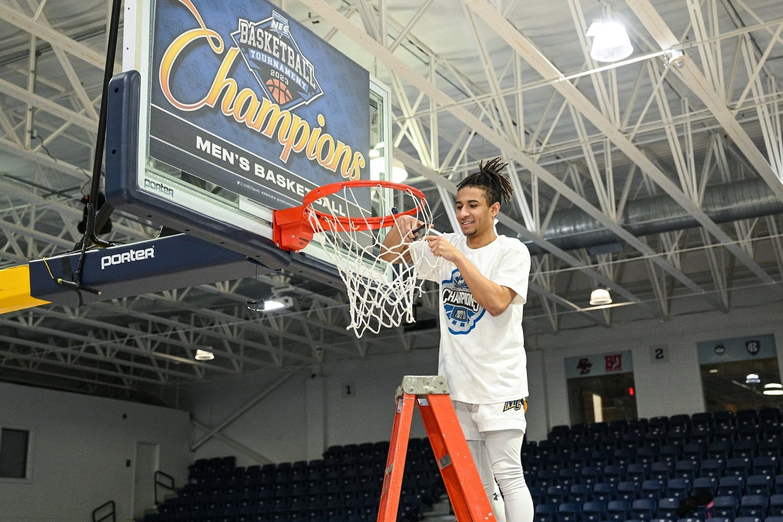 Javon Bennett, who transferred to UD from Merrimack, helps cut down the net after his Warriors team won the Northeast Conference Tournament last March. He averaged 18 ppg over three tournament games and was named to the All-Tournament team .CONTRIBUTED