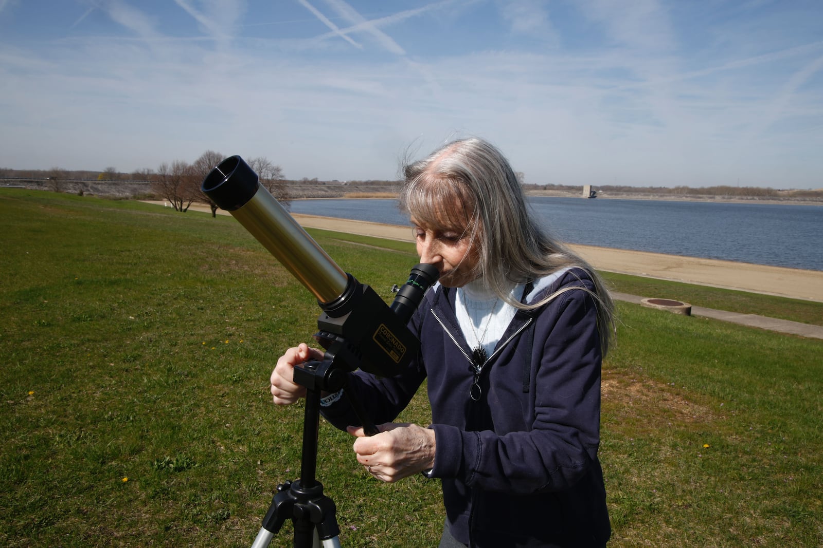 Susan Buccini of North Carolina sets up her specialized camera to view the total solar eclipse on Monday, April 8, 2024, at Buck Creek State Park in Clark County. This was Buccini's eighth total solar eclipse. She travels all around the world to see eclipses.  BILL LACKEY/STAFF