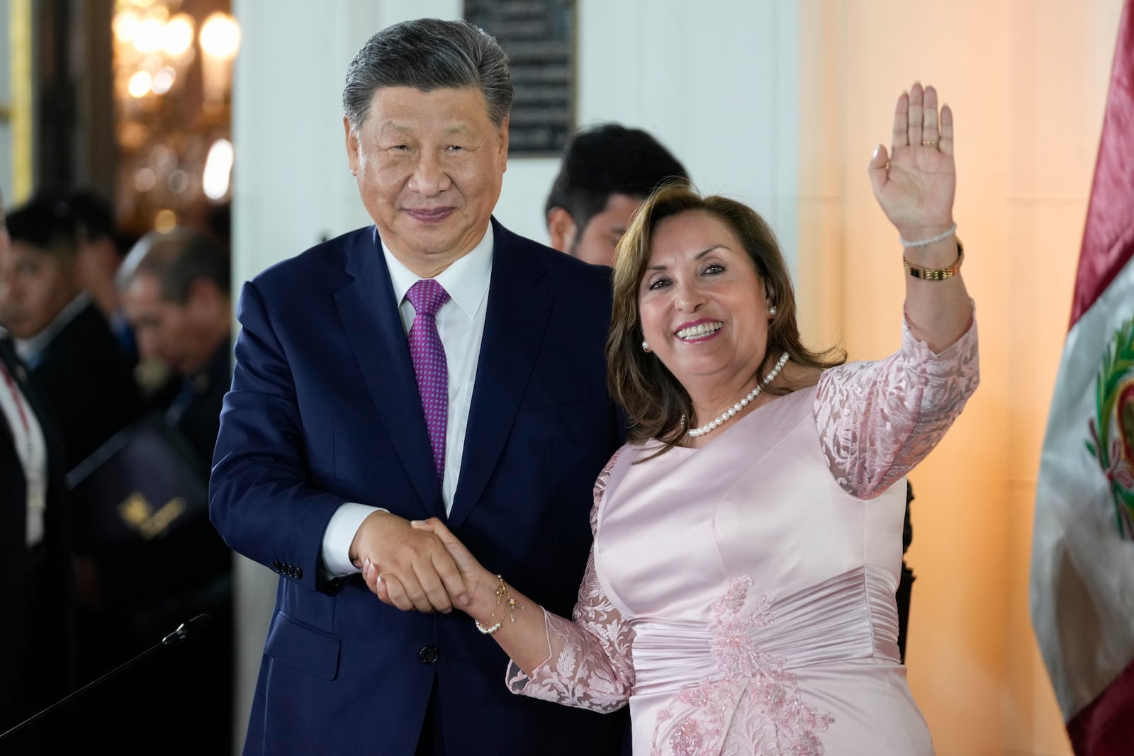 Peru's President Dina Boluarte, right, and Chinese President Xi Jinping shake hands after a ceremony to virtually inaugurate a Chinese-funded port in the city of Chancay, at the government palace in Lima, Peru, Thursday, Nov. 14, 2024. (AP Photo/Fernando Vergara)