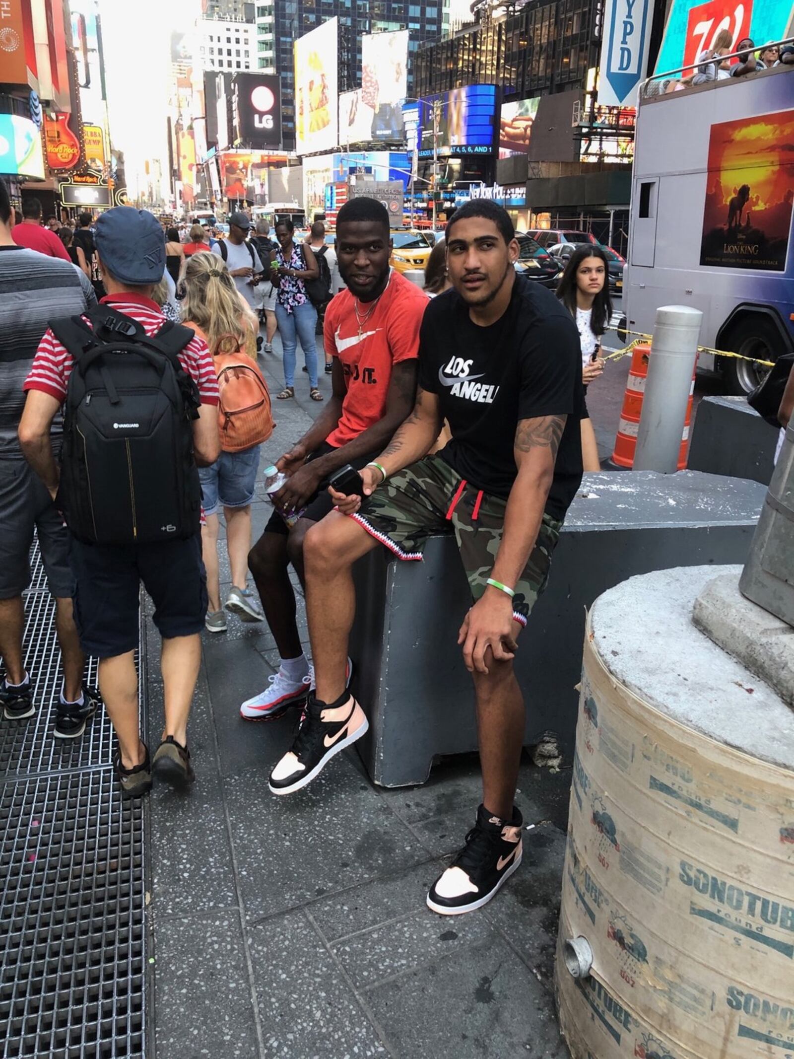 Dayton’s Obi Toppin (right) and Jalen Crutcher in Times Square last summer. CONTRIBUTED