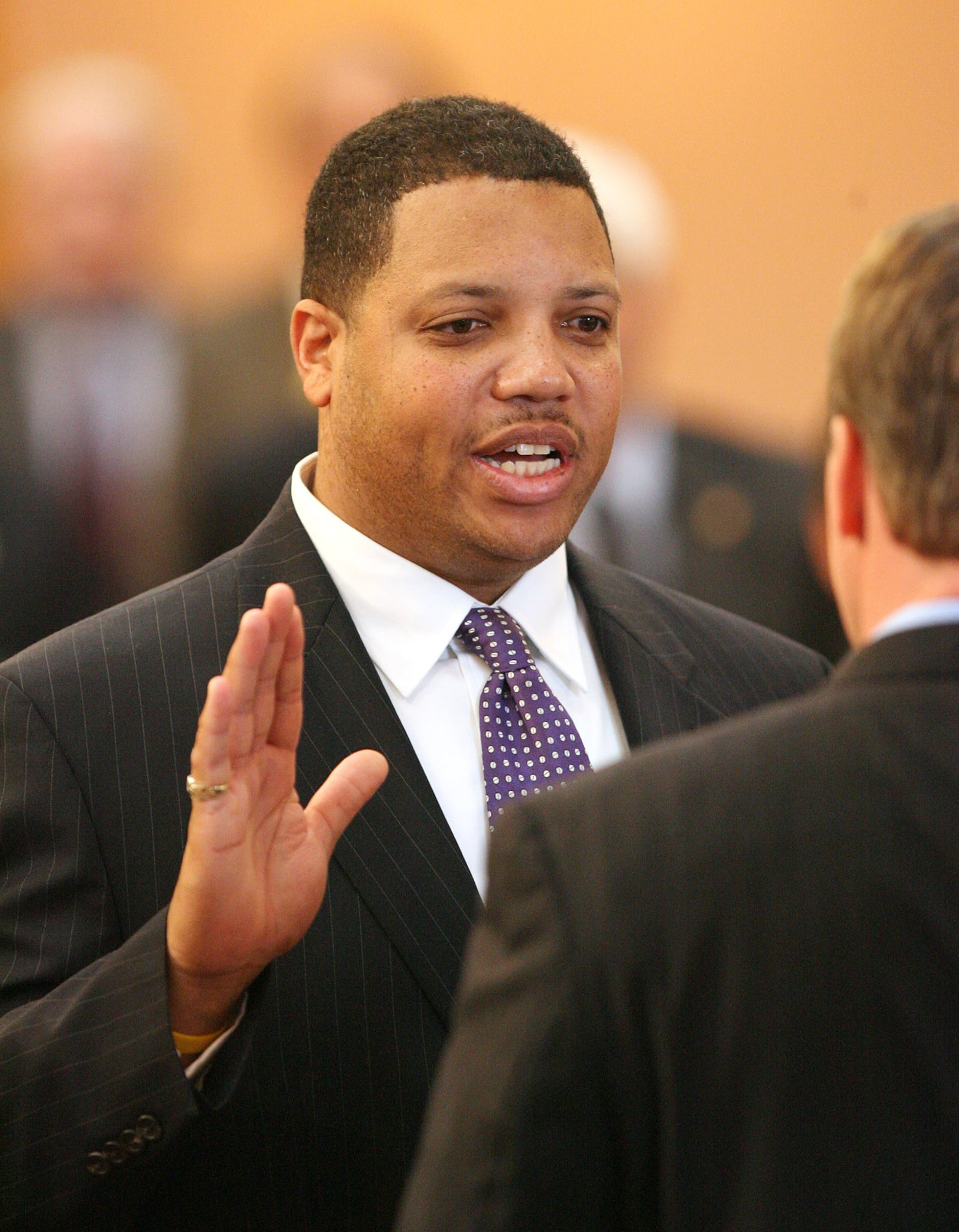 Clayton Luckie, D, 39th District, left, is sworn in by Speaker of the House Jon A. Husted Tuesday, Nov. 14, 2006, in Columbus, Ohio. (AP Photo/Terry Gilliam)