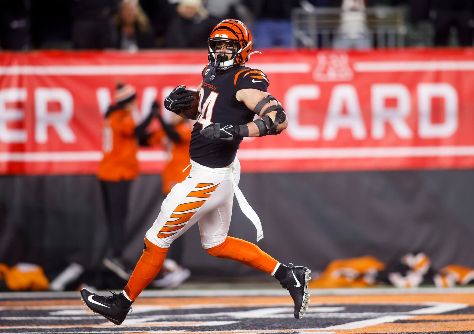 Bengals defensive end Sam Hubbard runs back a 98 yard touchdown during Cincinnati's Wild Card playoff game against the Baltimore Ravens Sunday, Jan. 15, 2023 at Paycor Stadium in Cincinnati. The Bengals won 24-17. NICK GRAHAM/STAFF