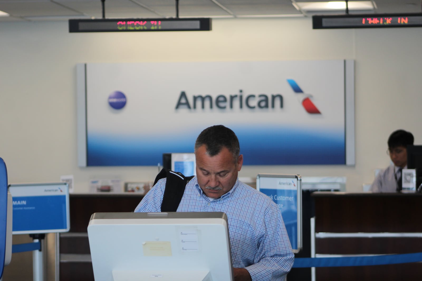 A traveler checks in at the Dayton International Airport on May 23, 2023. CORNELIUS FROLIK / STAFF