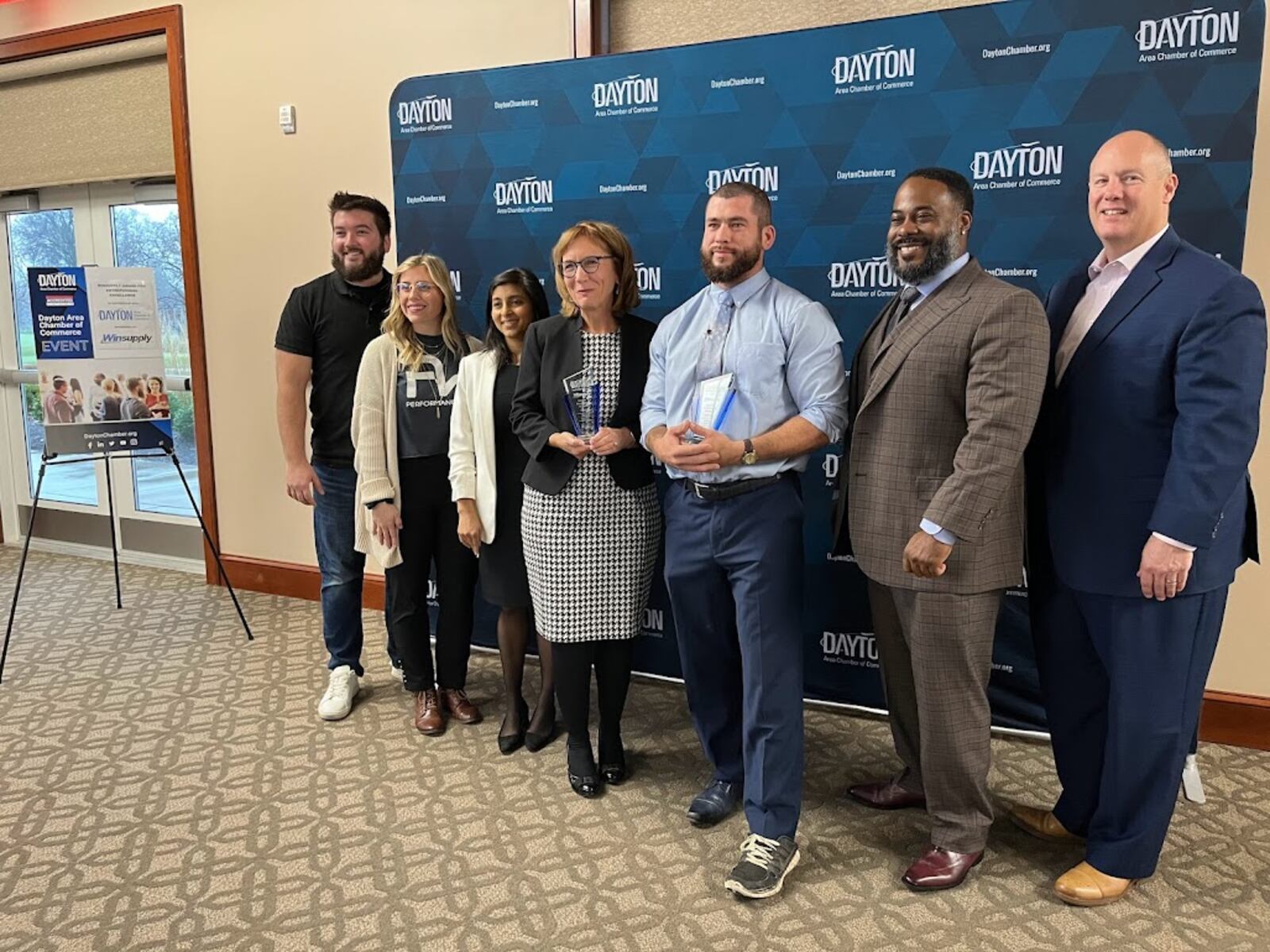 From left: Andrew and Tanor Banks, owners of Performance Wraps; Kamna Gupta, vice president of support services for Winsupply; Betsy Westhafer, owner of The Congruity Group; Jeremy Turner, owner of Apply Pressure Washing; Anthony Head, owner of Chicken Head’s; and Chris Kershner, president and CEO of the Dayton Area Chamber of Commerce. THOMAS GNAU/STAFF