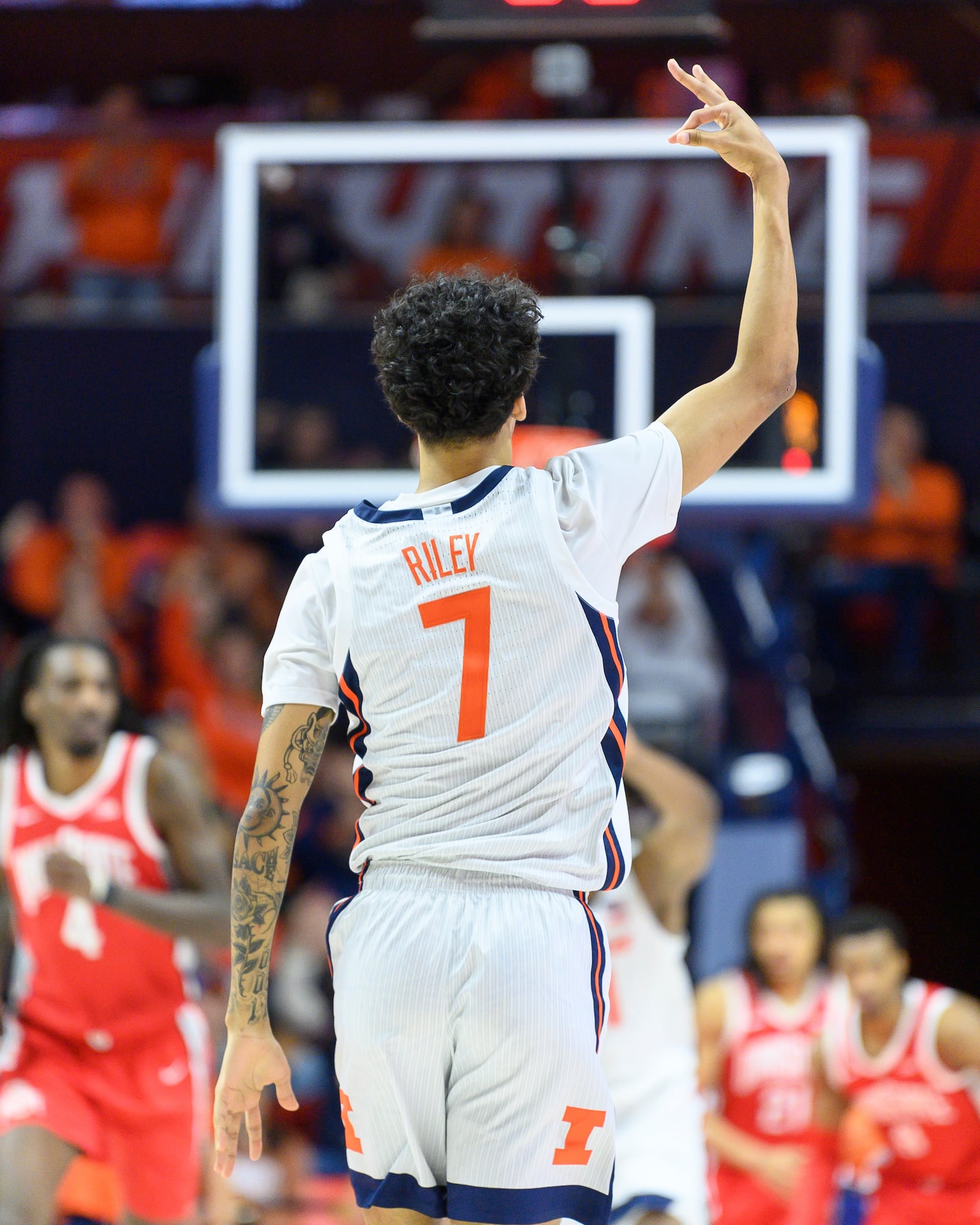 Illinois' Will Riley celebrates during the second half of an NCAA college basketball game against Ohio State, Sunday, Feb. 2, 2025, in Champaign, Ill. (AP Photo/Craig Pessman)