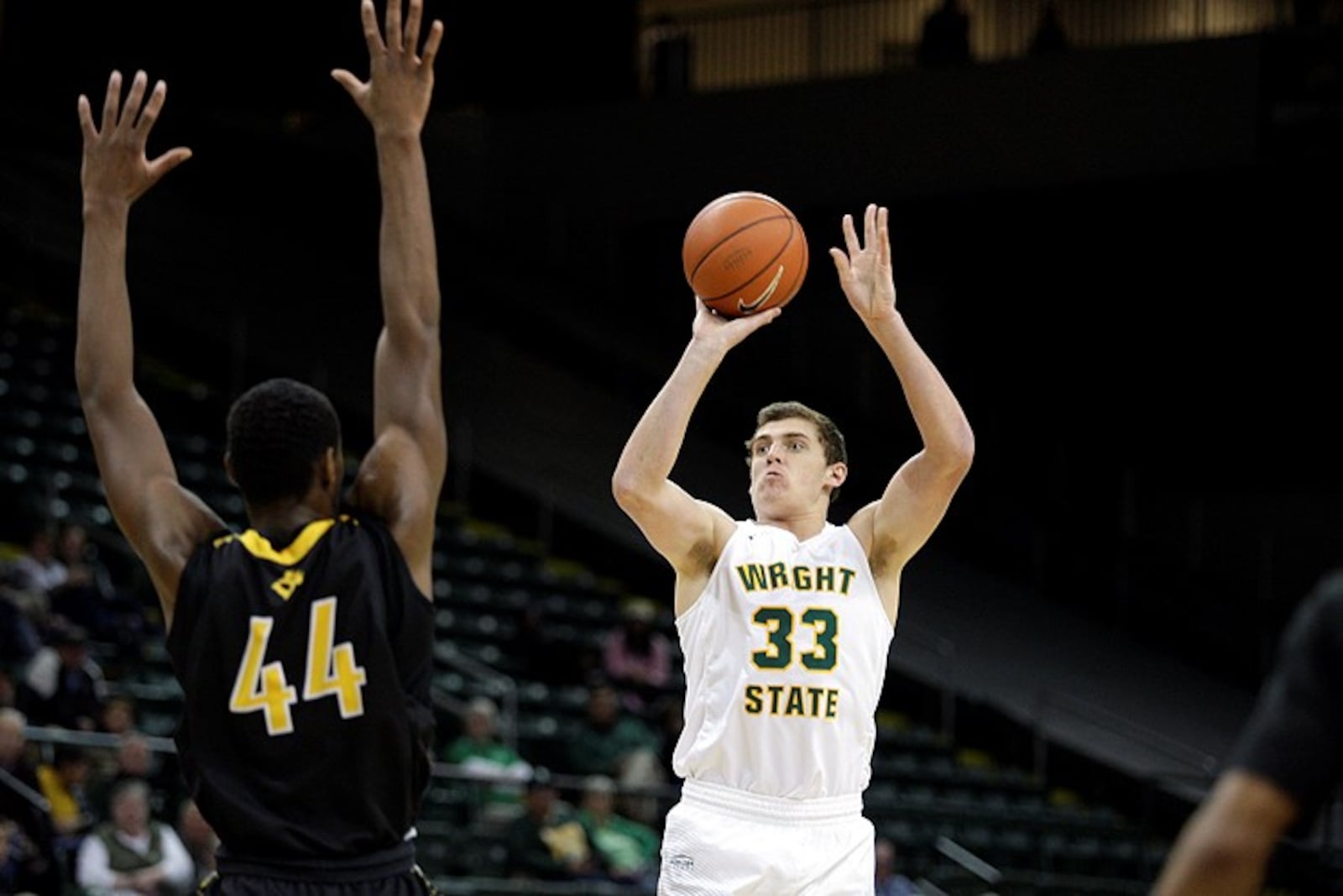 Wright State’s Ryan Custer (33) shoots over Ohio Dominican’t Hasan Varence at the Nutter Center on Monday, Nov. 21, 2016. Tim Zechar / Contributed Photo