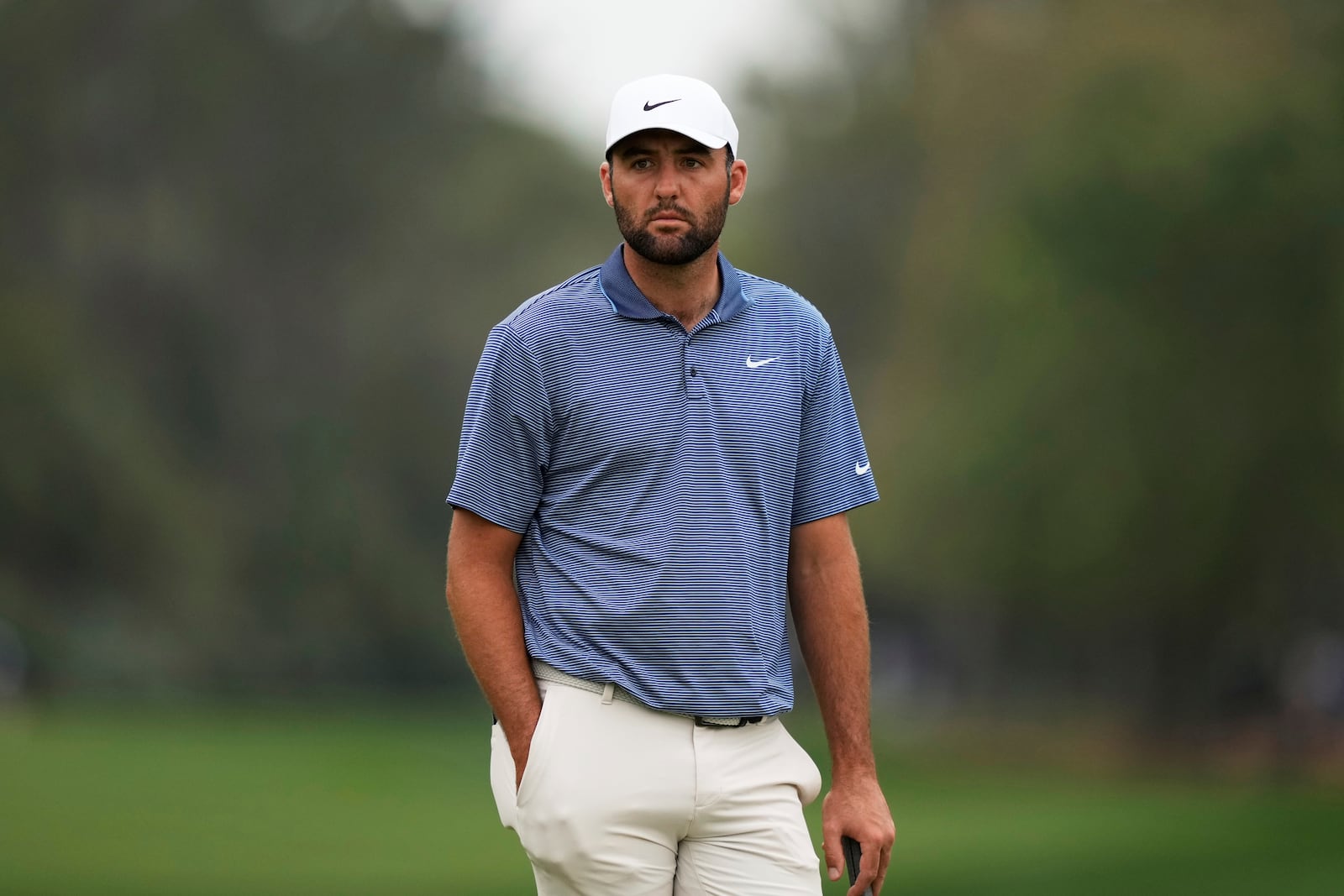 Scottie Scheffler waits for his turn on the second hole during the final round of The Players Championship golf tournament Sunday, March 16, 2025, in Ponte Vedra Beach, Fla. (AP Photo/Julia Demaree Nikhinson)