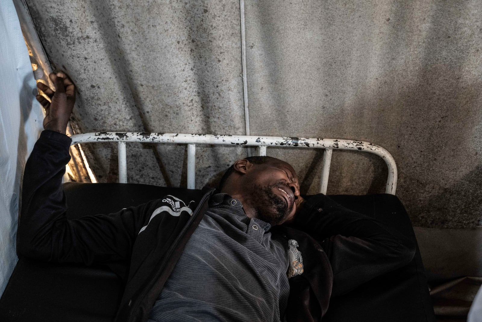 Medics treat a man wounded during fighting between Congolese government troops and M23 rebel forces in Goma's Kyeshero hospital Saturday, Feb. 1, 2025. (AP Photo/Moses Sawasawa)