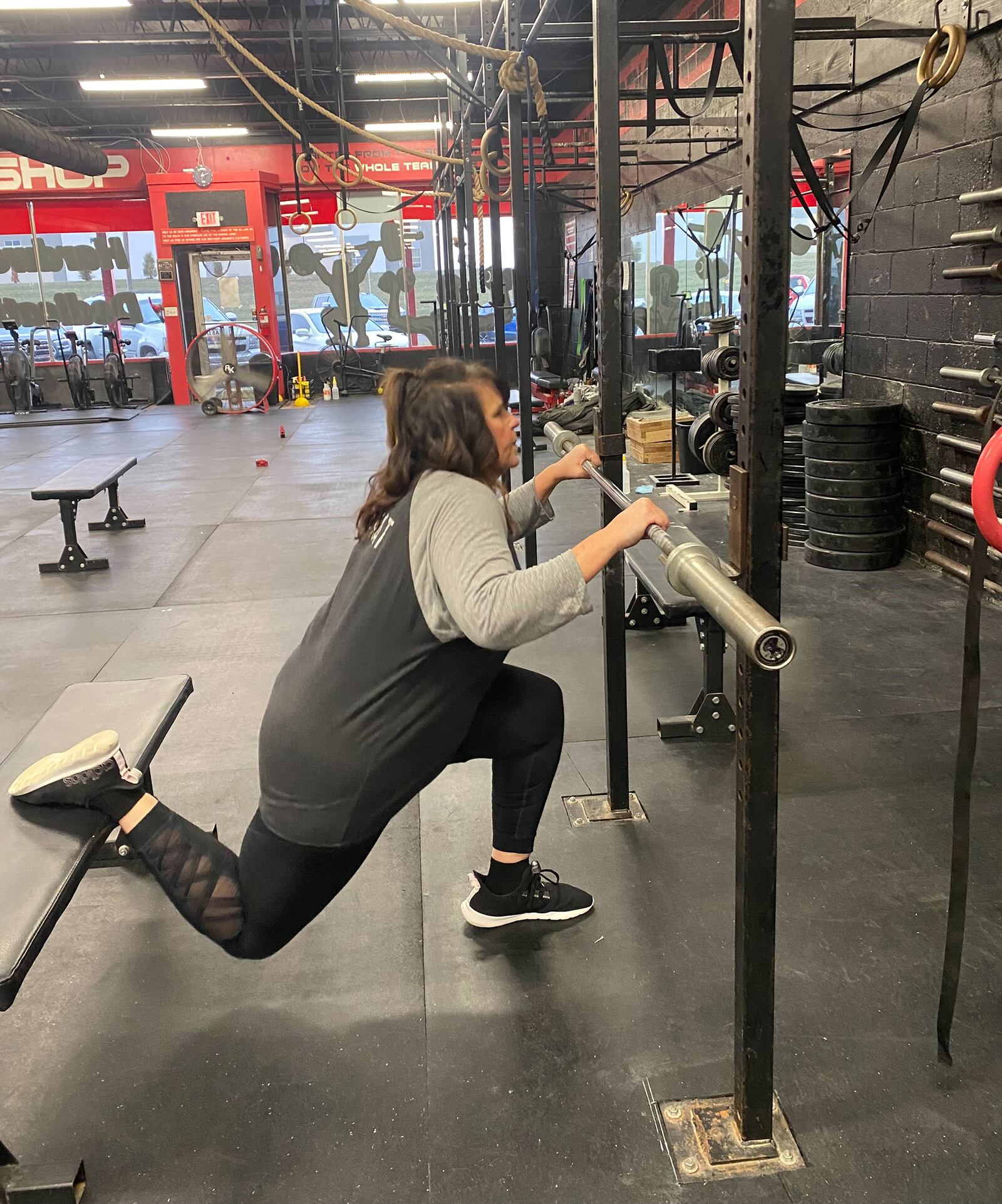 Katy Kuns has recently been diagnosed with arthritis in her knee and is working on improving strength and mobility in her legs. Here she is doing a Bulgarian Split Squat at MPower Gym in Vandalia. CONTRIBUTION