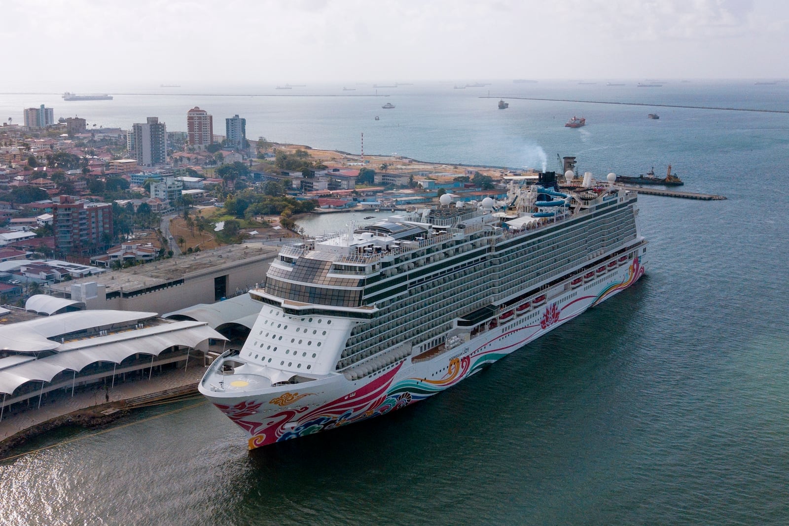 FILE - Bahamas flagged cruise ship Norwegian Joy stands at anchorage before its departure from the Colon 2000 port at Manzanillo Bay in Colon, Panama, Thursday, April 20, 2023. (AP Photo/Arnulfo Franco, File)