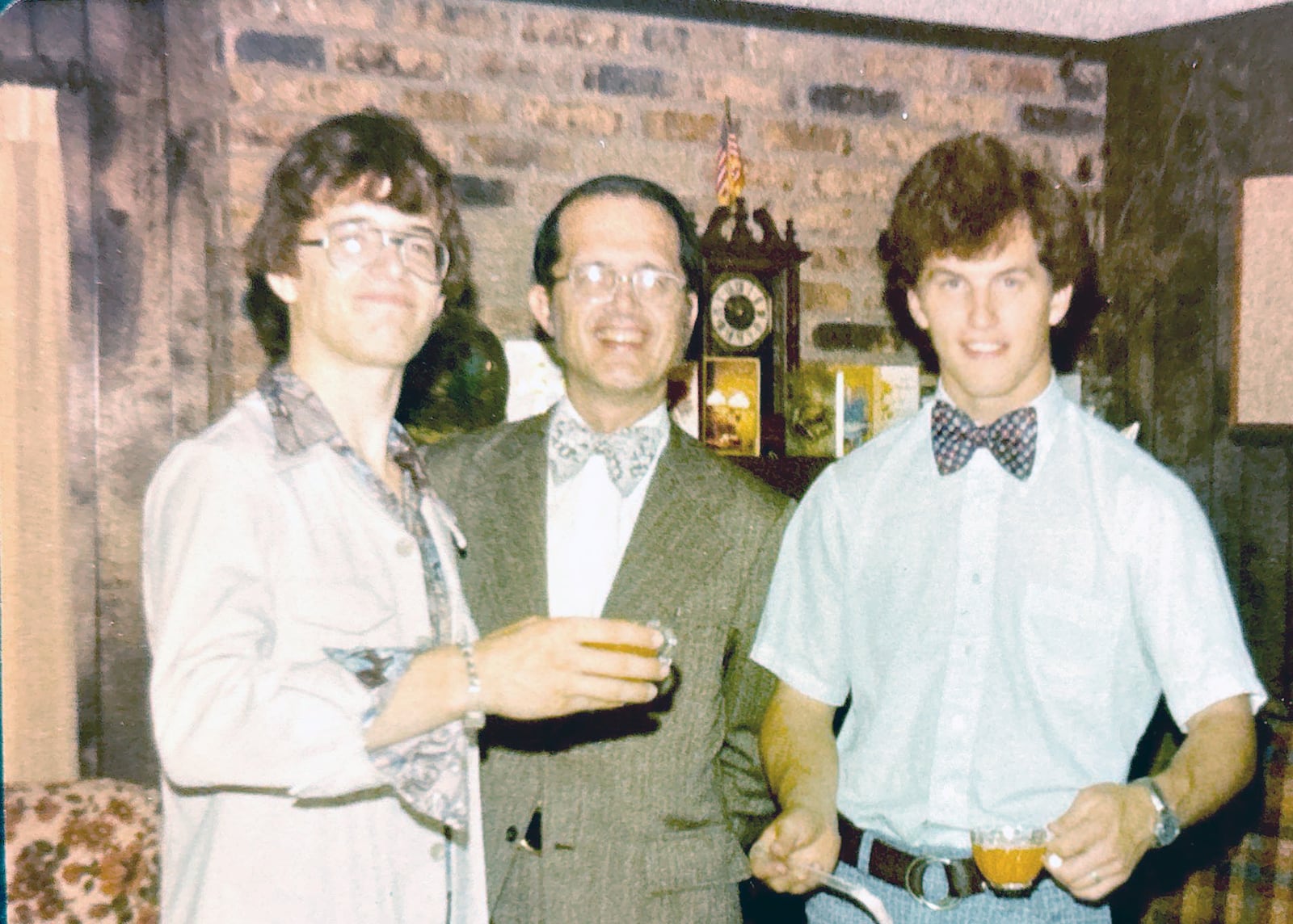 Taylor (L) with his father Bob (center) and older brother Charles Taylor after graduating from Butler University and preparing to go to medical school. Taylor came from a family of medical professionals.