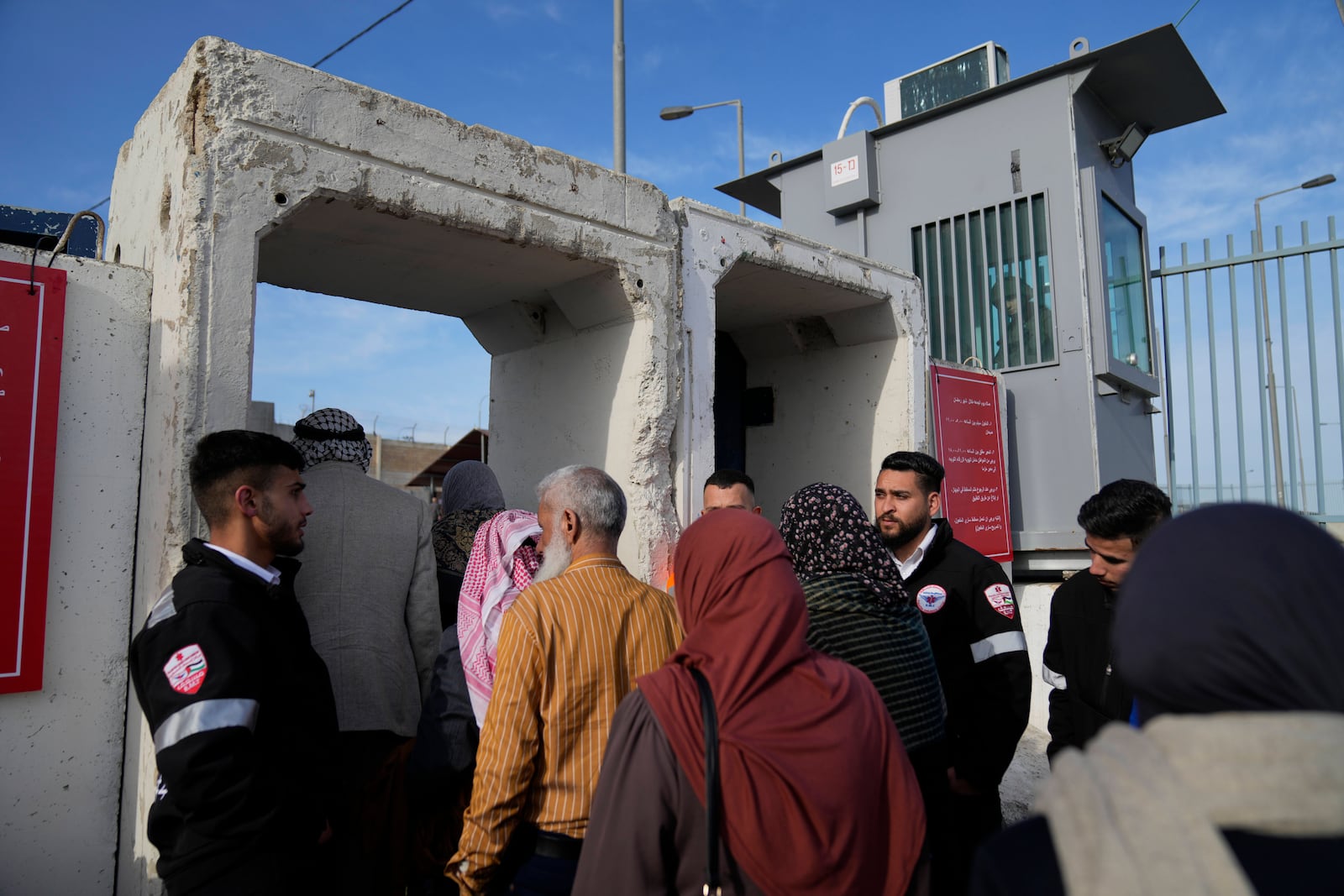 Palestinians cross from the Israeli military Qalandia checkpoint near the West Bank city of Ramallah to Jerusalem, to participate in the Friday prayers at the Al-Aqsa Mosque compound during the Muslim holy month of Ramadan on Friday, March 14, 2025. (AP Photo/Nasser Nasser)