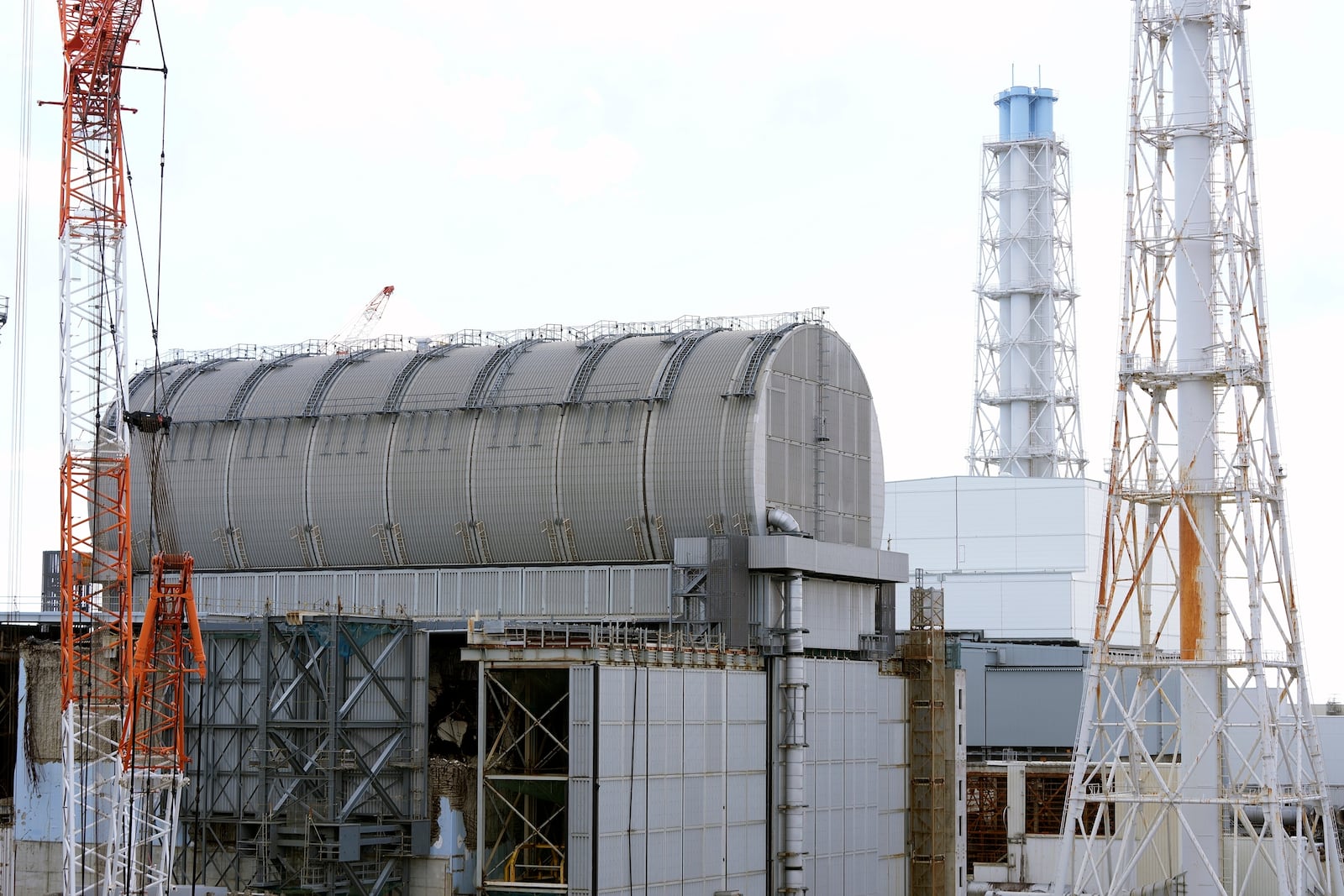 The Unit 3 reactor covered with protective housing at the Fukushima Daiichi nuclear power plant, run by Tokyo Electric Power Company Holdings (TEPCO), is seen in Okuma town, northeastern Japan on Monday Feb. 20, 2025. (AP Photo/Eugene Hoshiko)