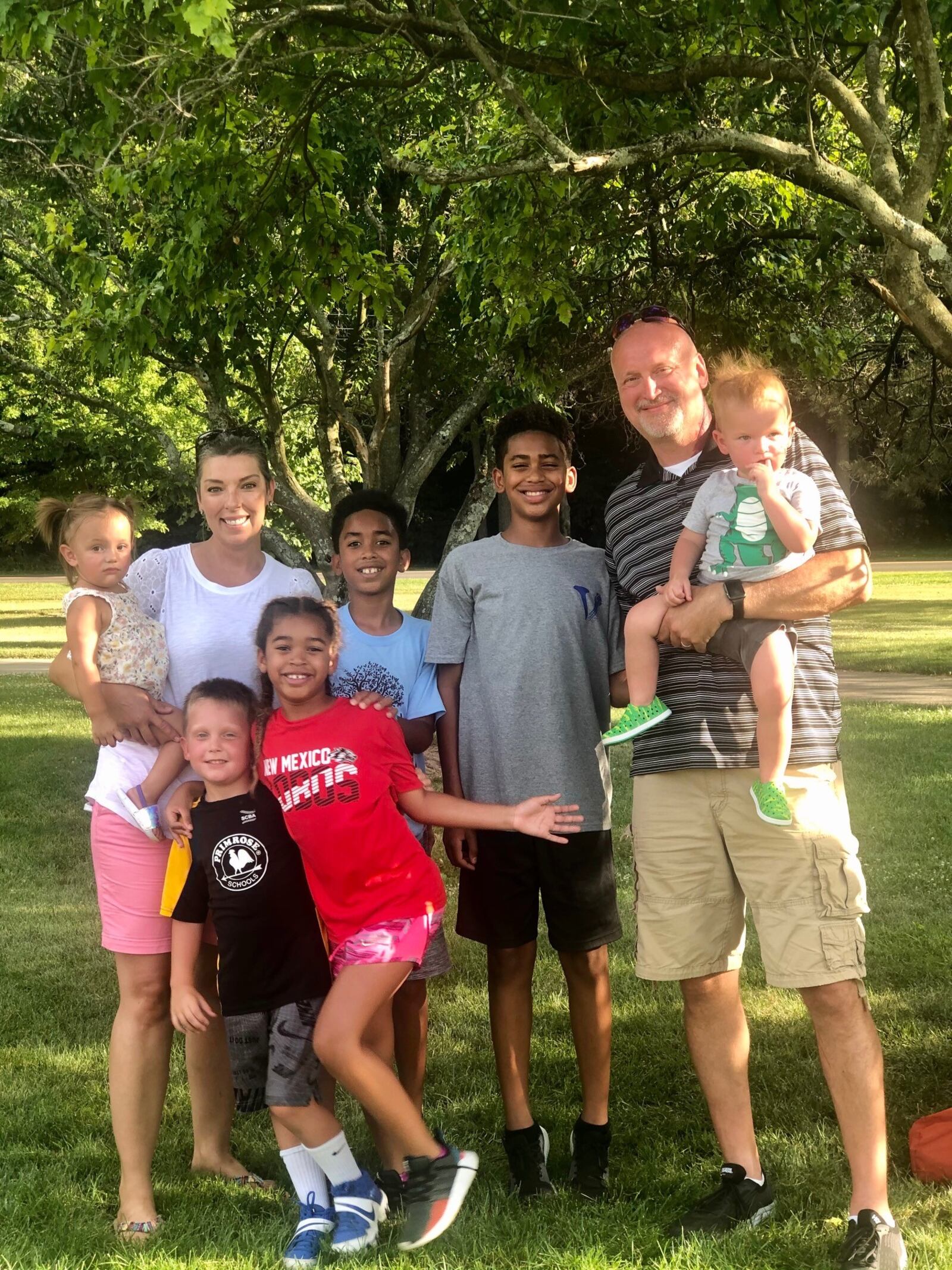 Tiffany and Tom Thompson with six of their seven grand children. CONTRIBUTED